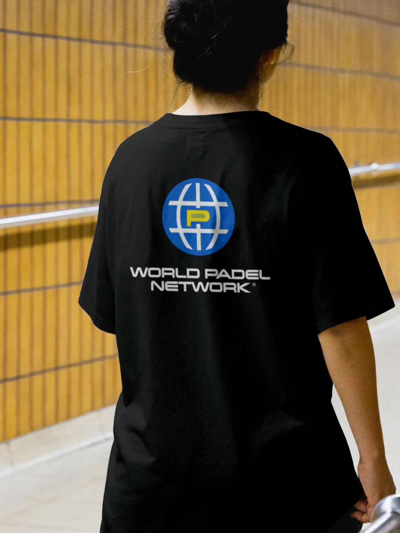 World Padel Network — Black T-shirt with WPN globe mark printed on the back — Merchandise application