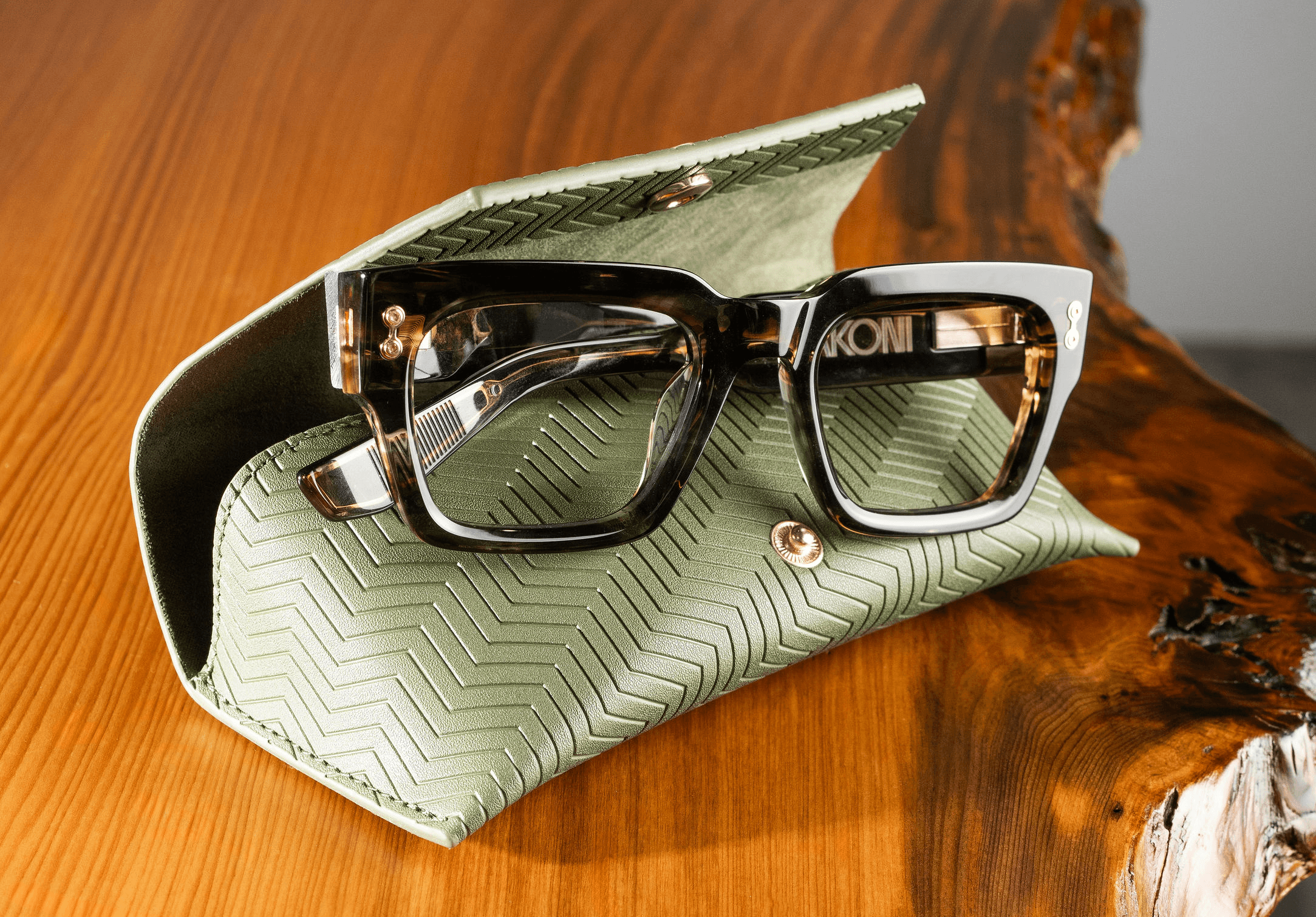Glasses sitting on green glasses case