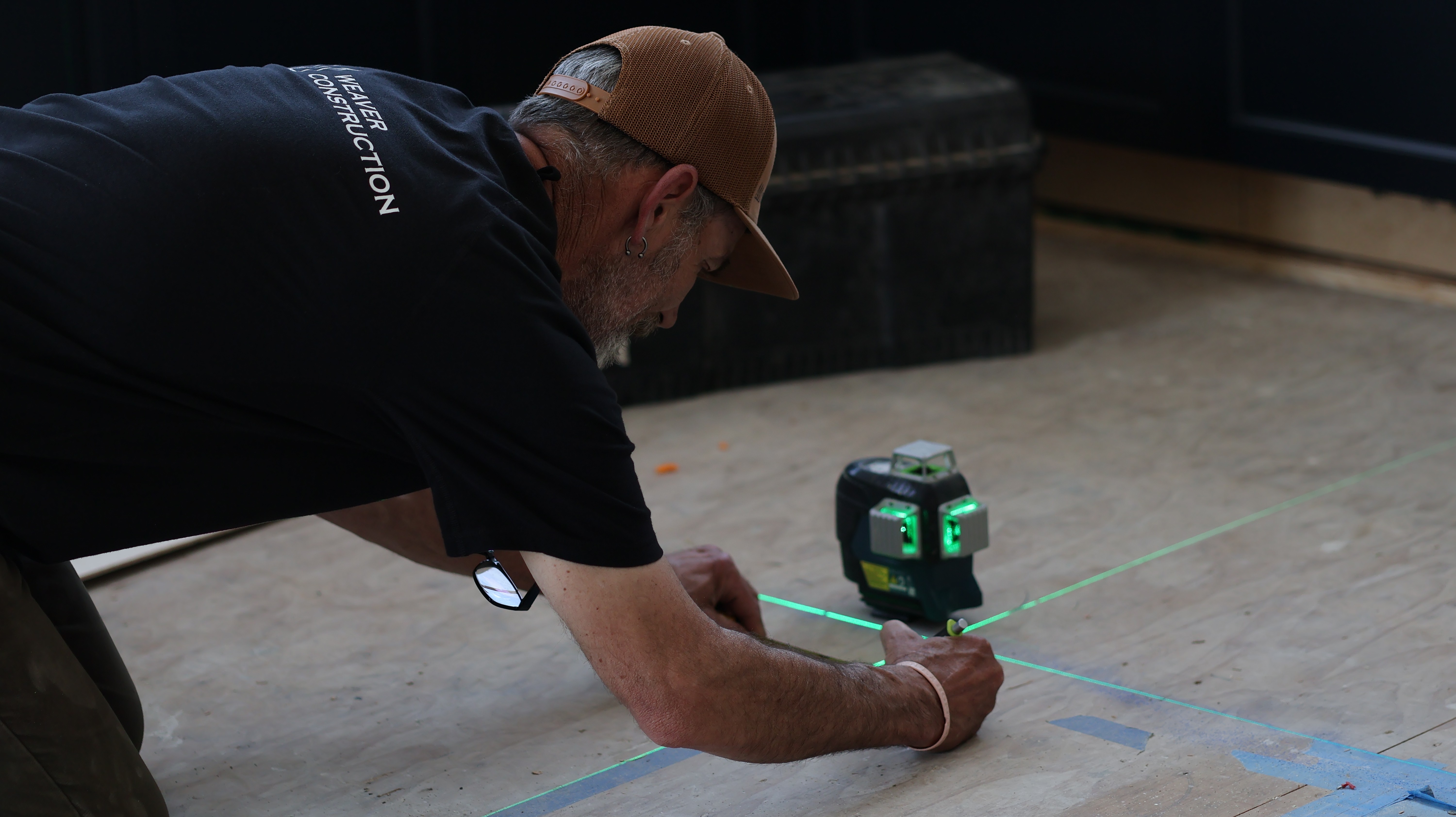 A Weaver Worker Measuring with a Laser Level