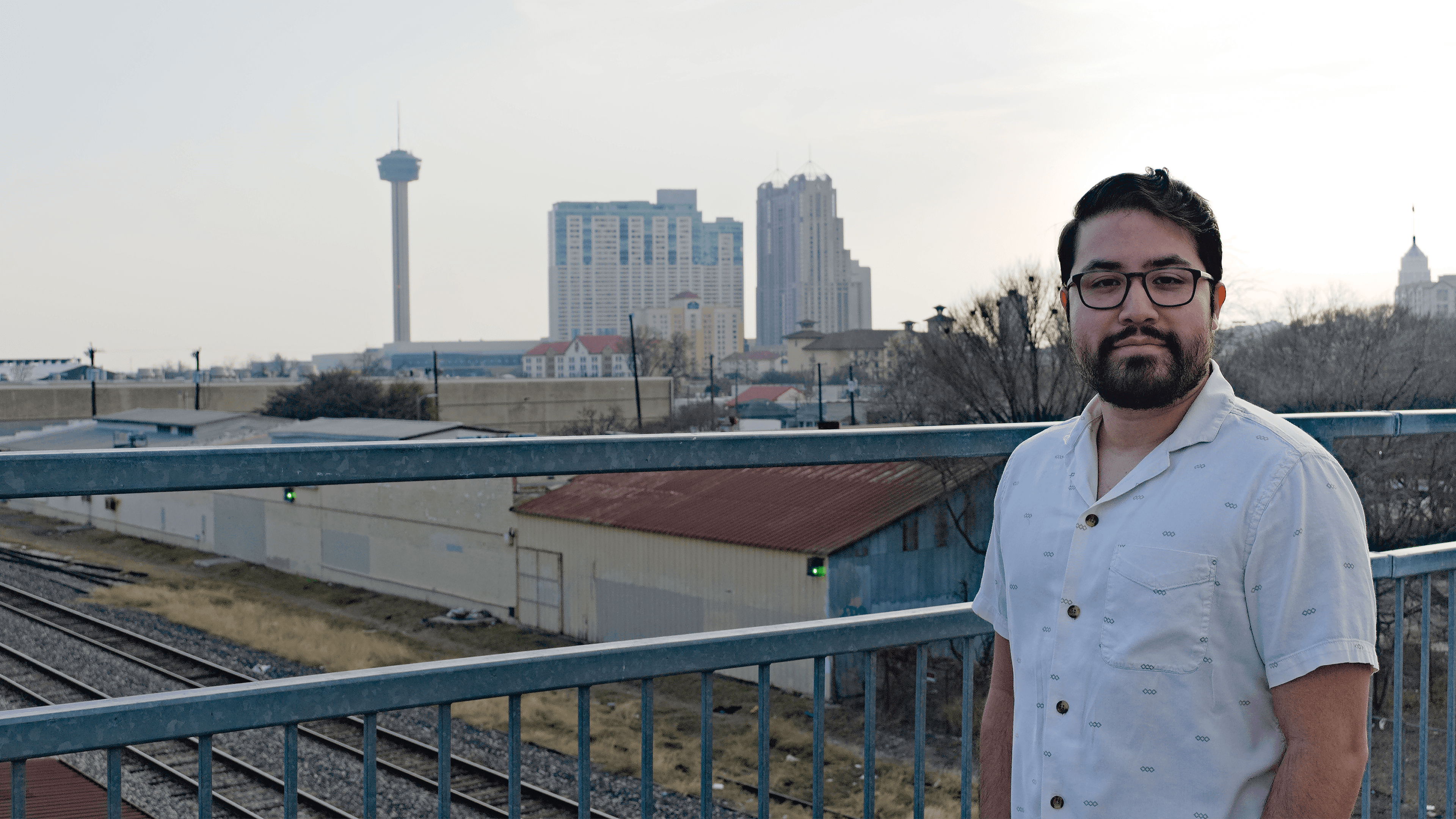 headshot image of Jozabad with San Antonio skyline