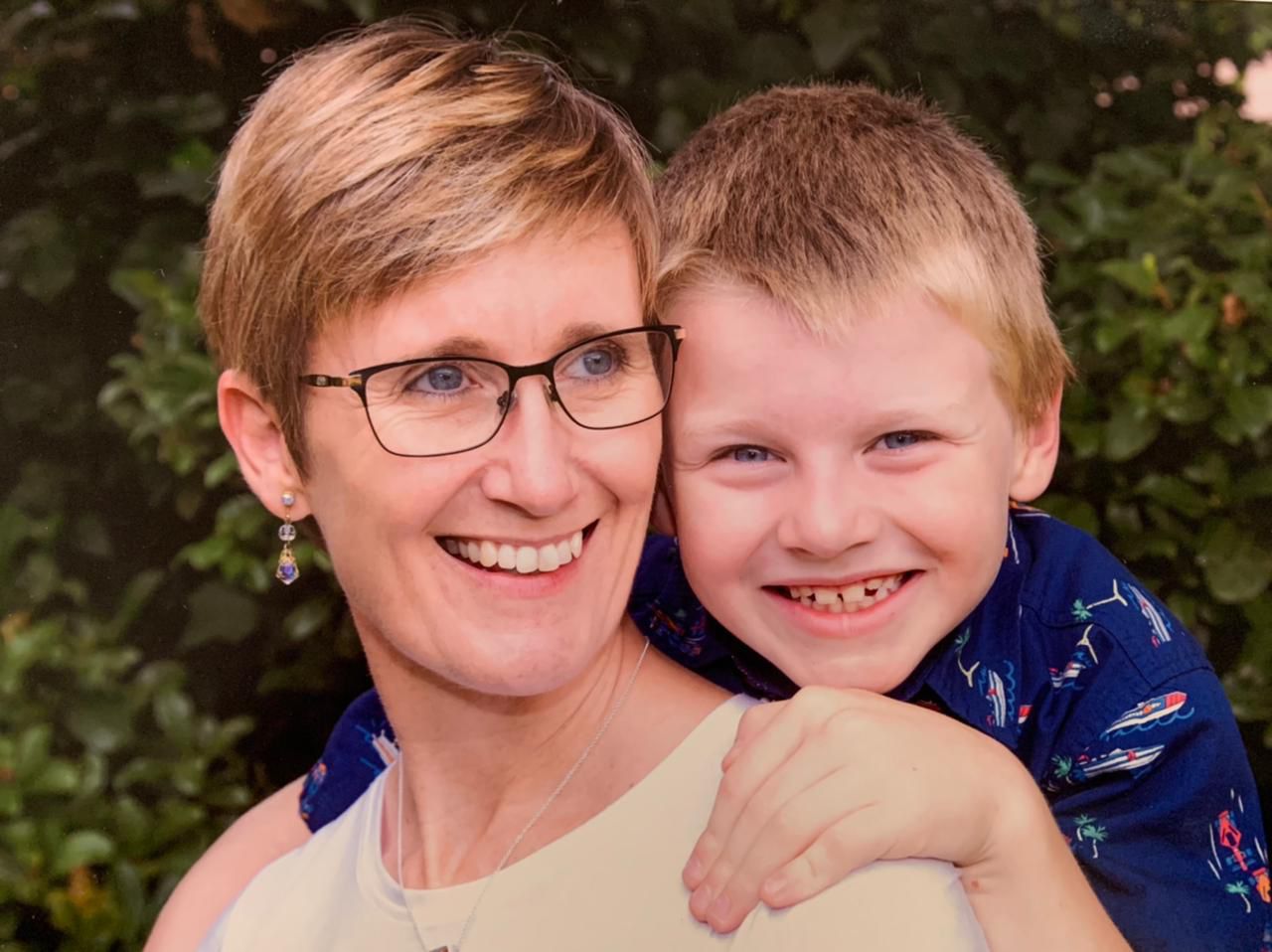 Portrait of founder Shawna Stapel with a young boy.