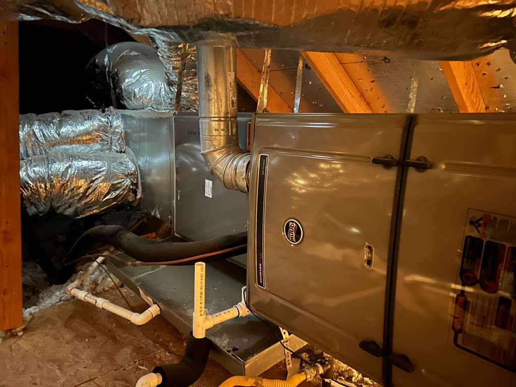 HVAC ductwork and air handler in attic showing potential air leaks affecting cooling performance in Fort Worth home
