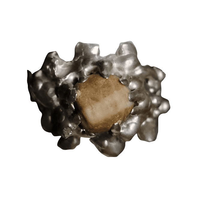 Sculpted silver ring with rough, uneven surface with yellow stone