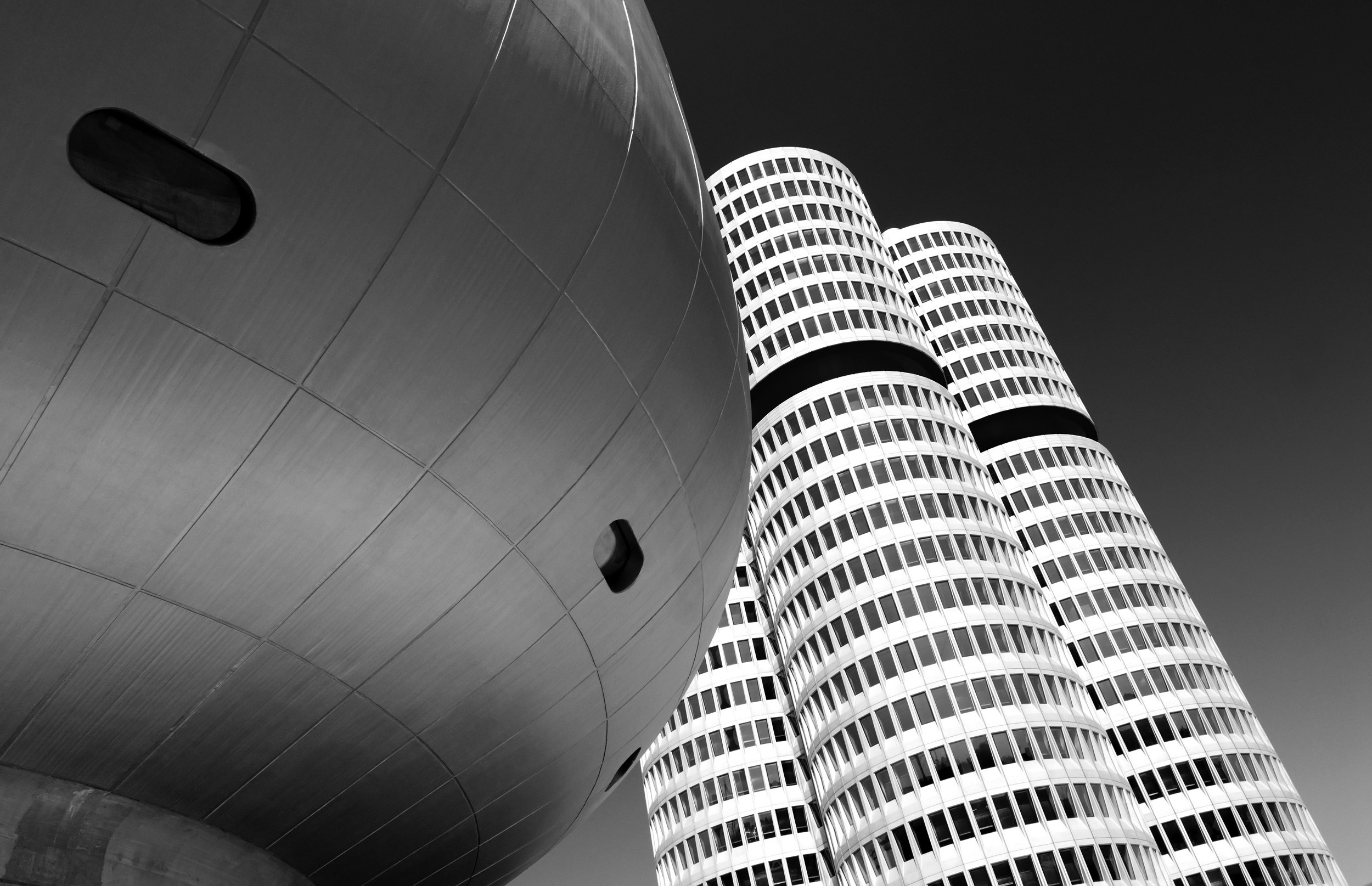 BMW headquarters towers and BMW Welt architecture in Munich, a key destination for private jet charter to and from Munich