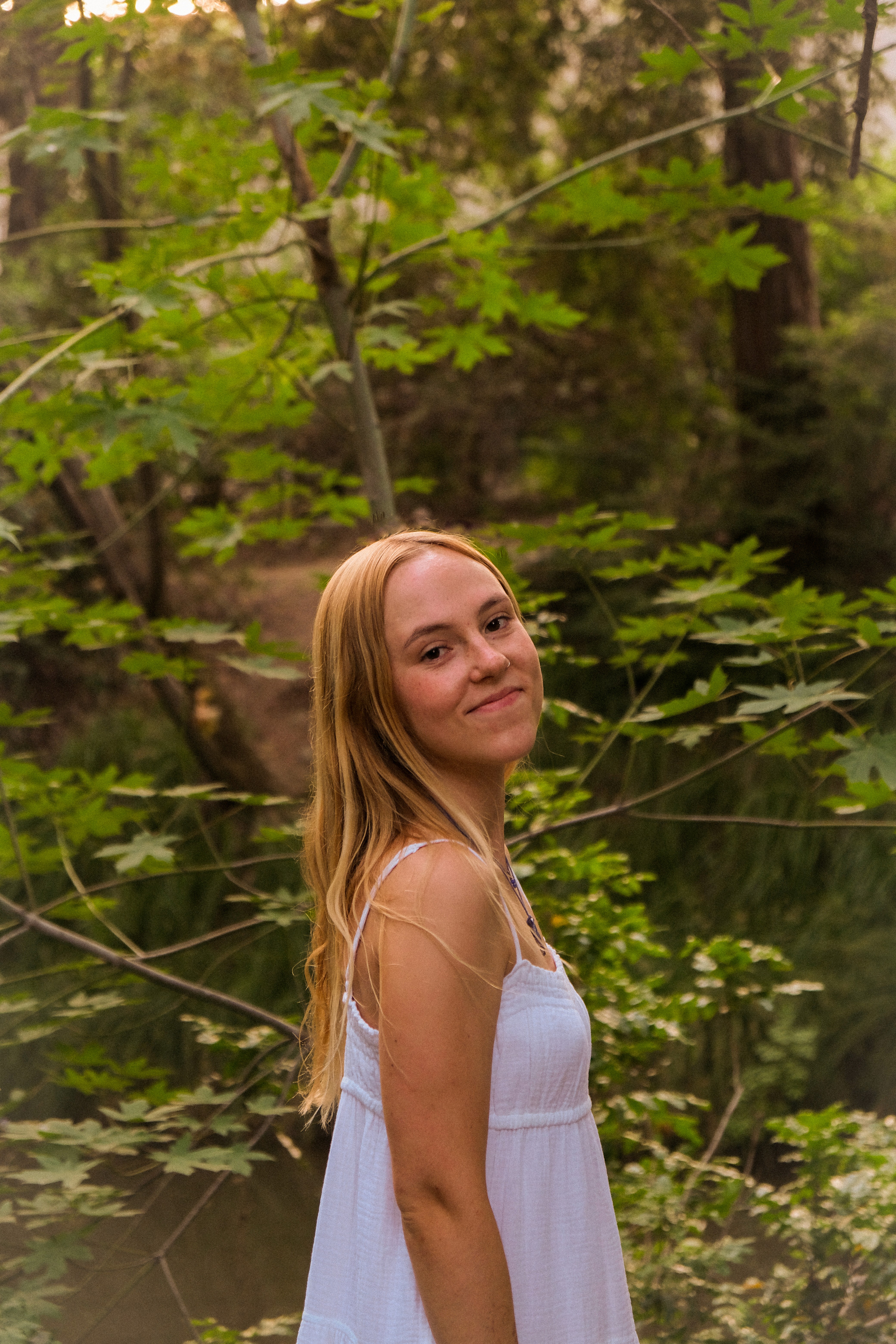 Image of Nola Zimdars in front of a tree