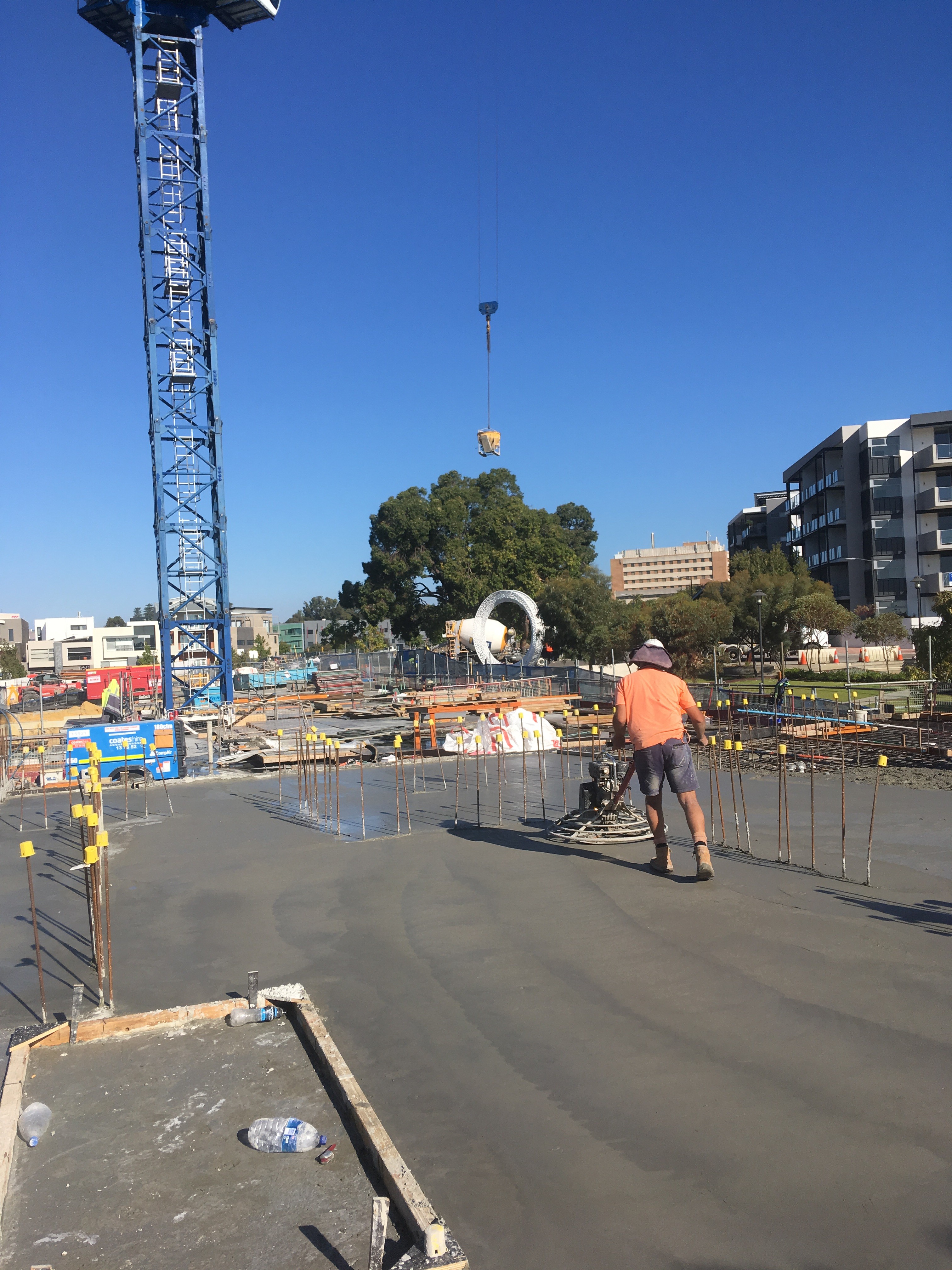 Rachel, personal trainer, looking to the side confidently in a fitness studio