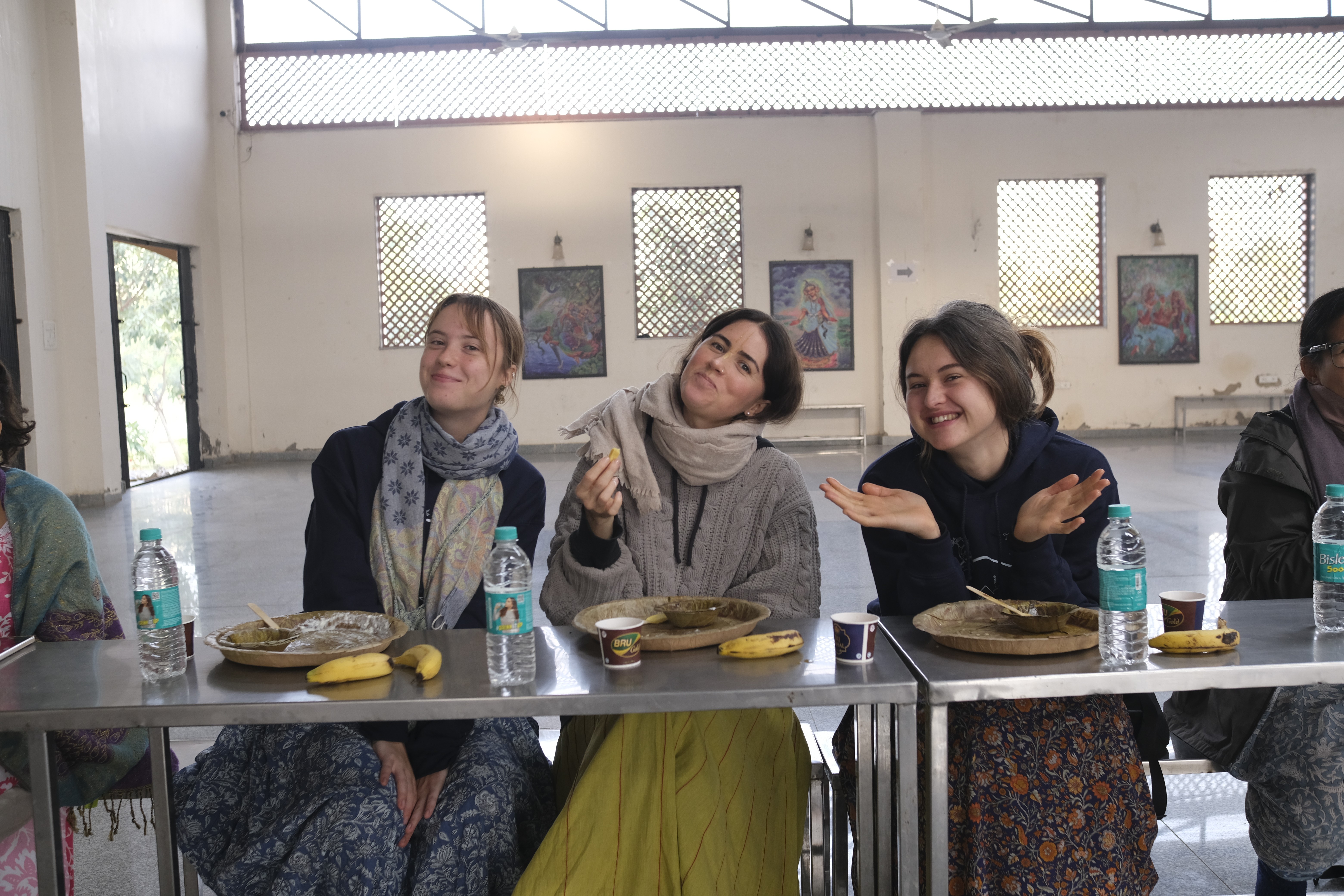 A man stading with Surfboard