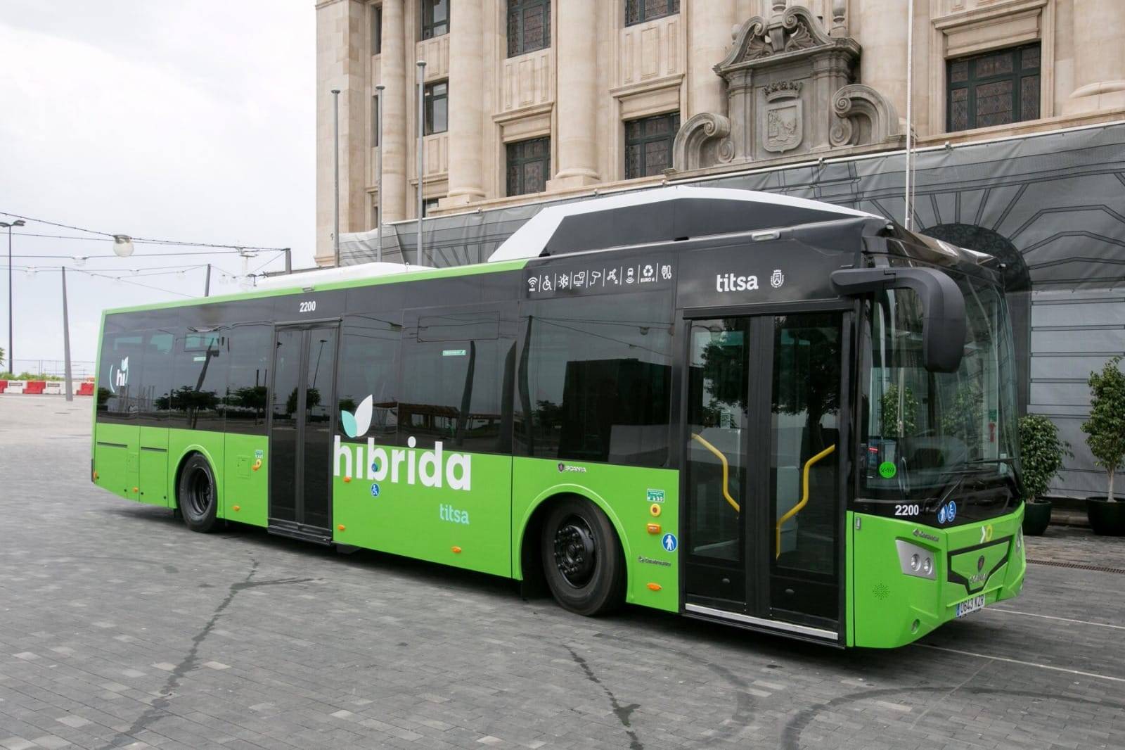 green bus on road