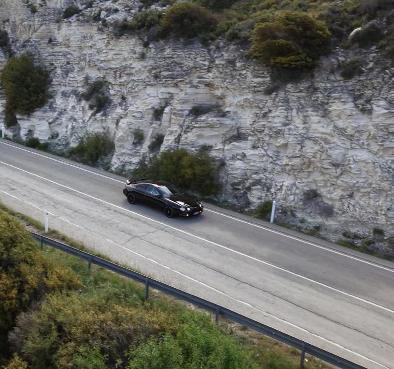gray mercedes benz coupe on black asphalt road during daytime