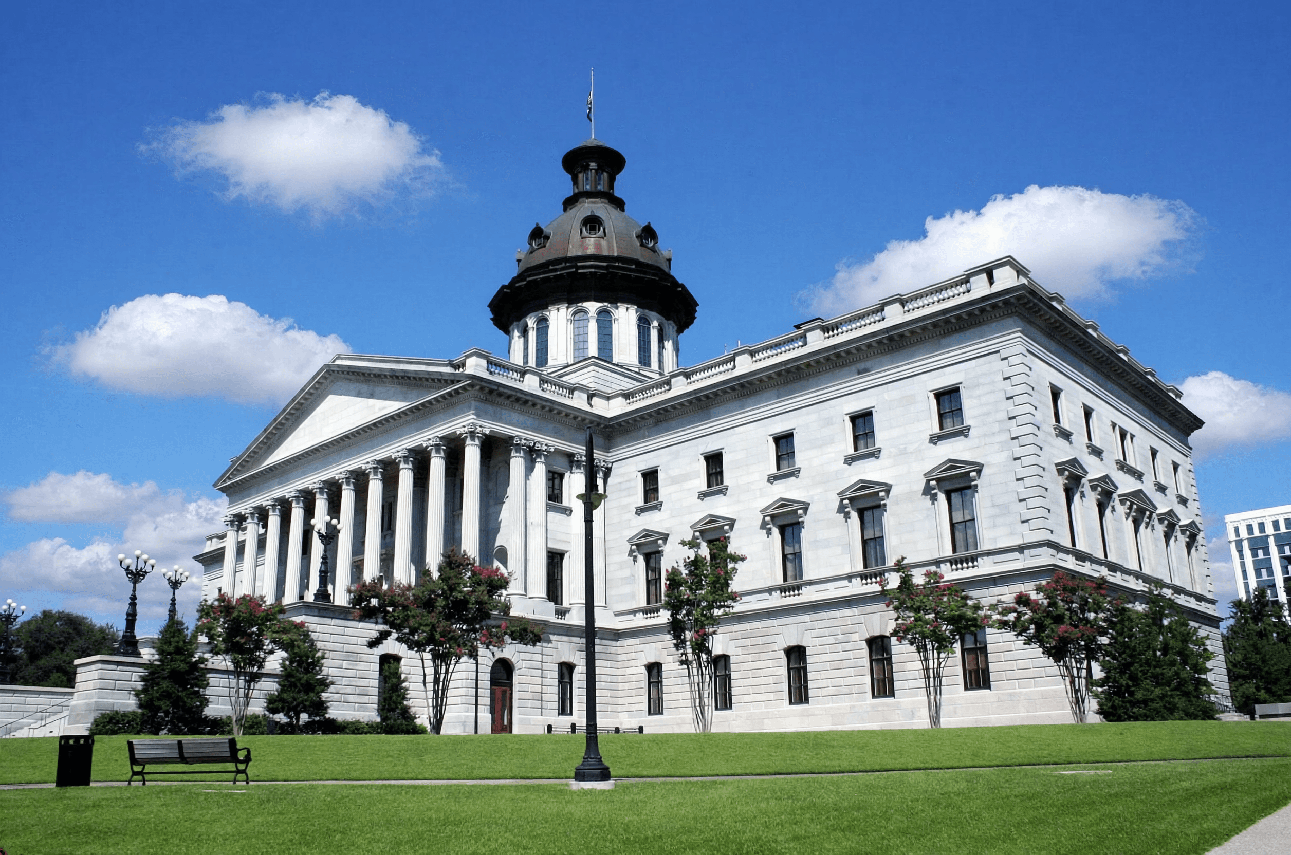 five children smiling while doing peace hand sign