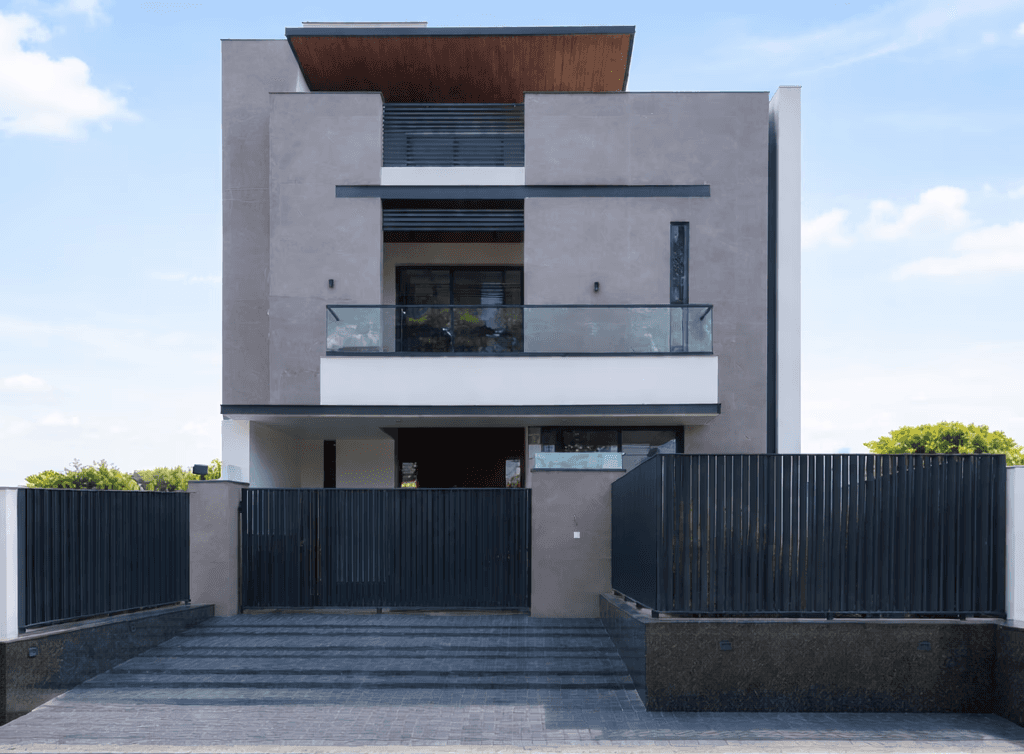 Front view of a modern wooden architecture building on grass with blue sky.