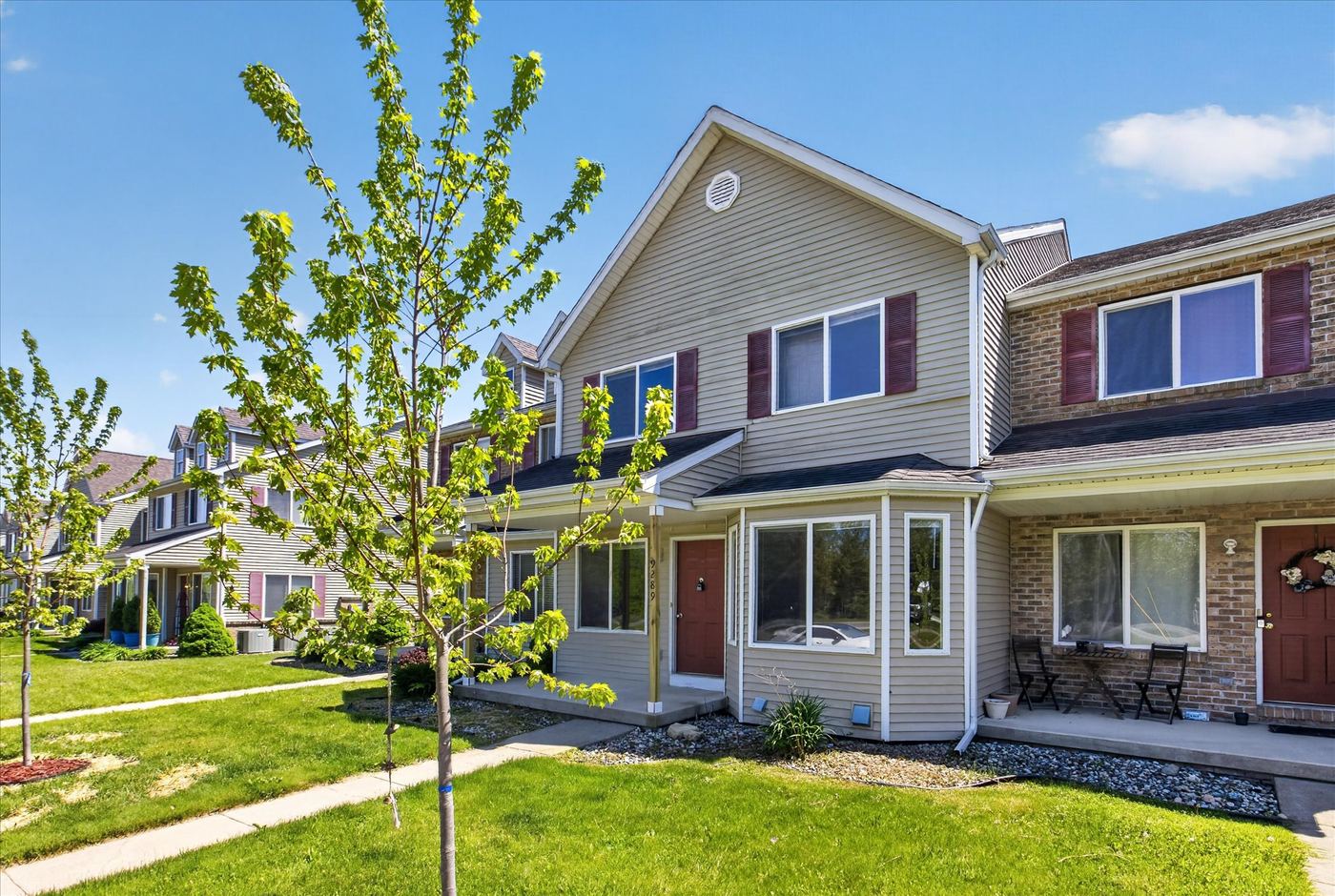 Townhome entrances and landscaped grounds at Cedar Creek Court