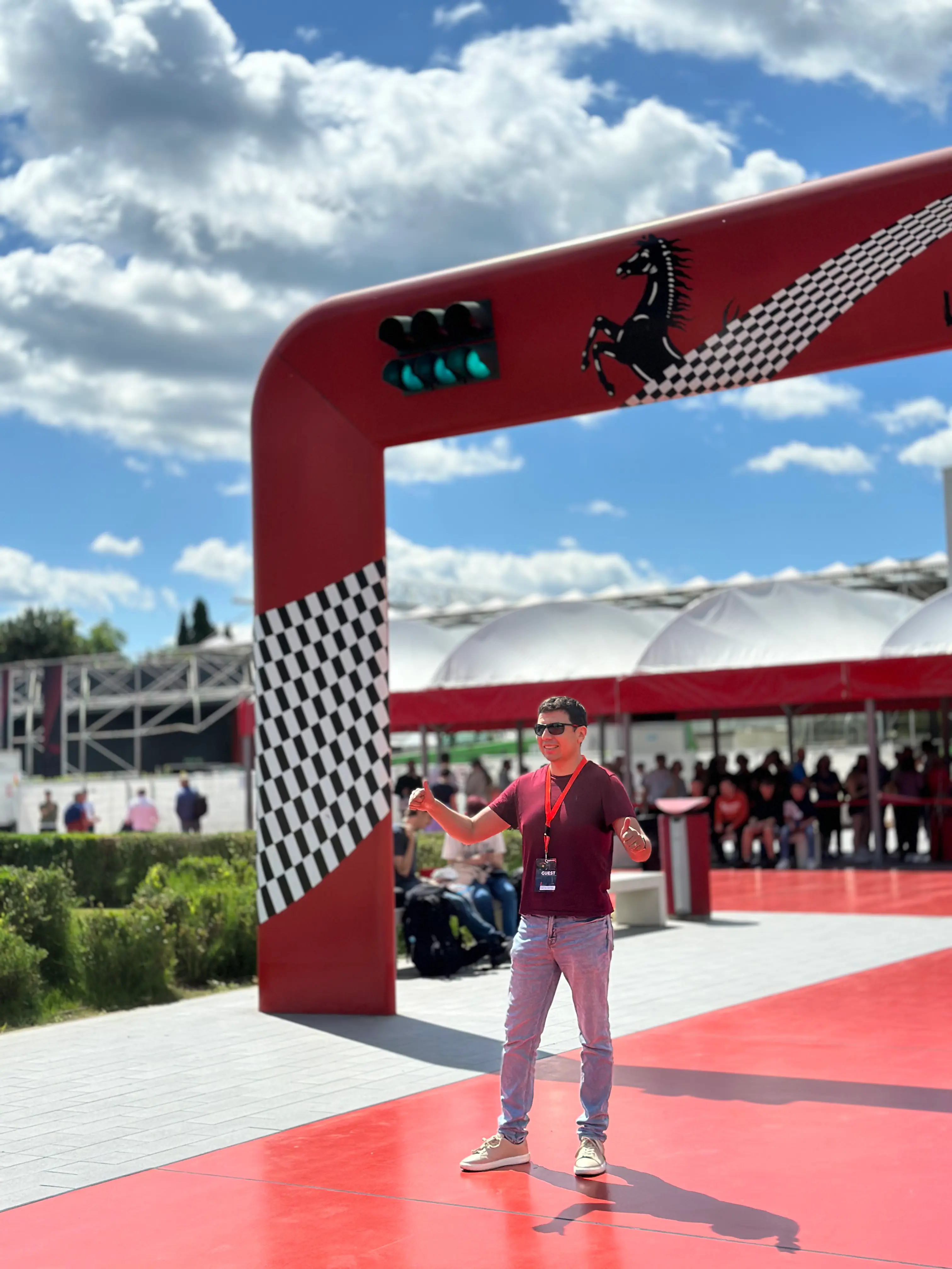 a desk with a computer and speakers on it