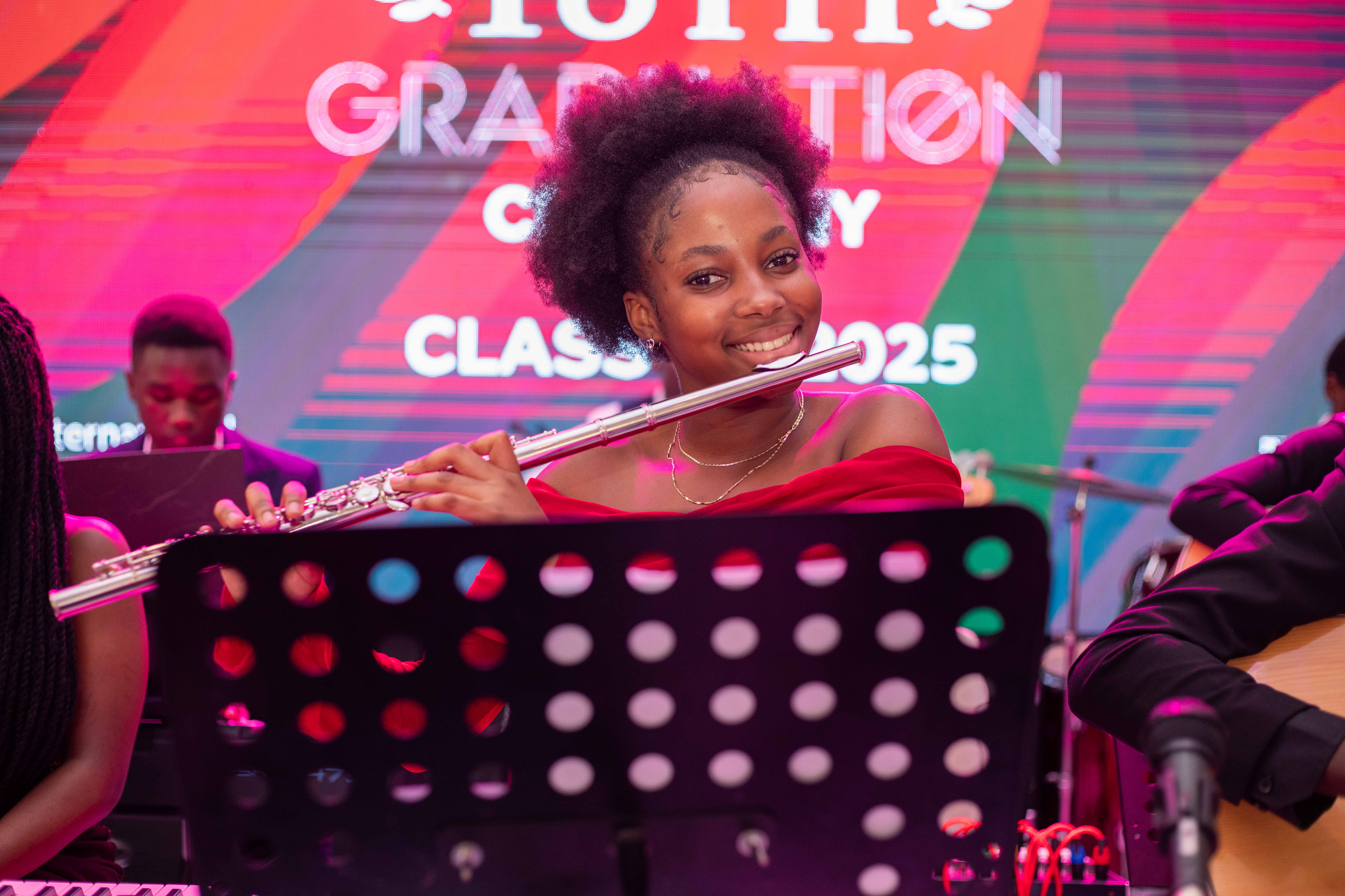 A student stands with a backpack on, ready for school