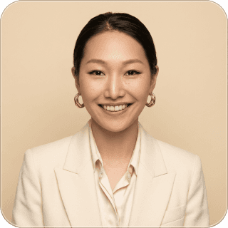 a man sitting at a desk talking on a cell phone