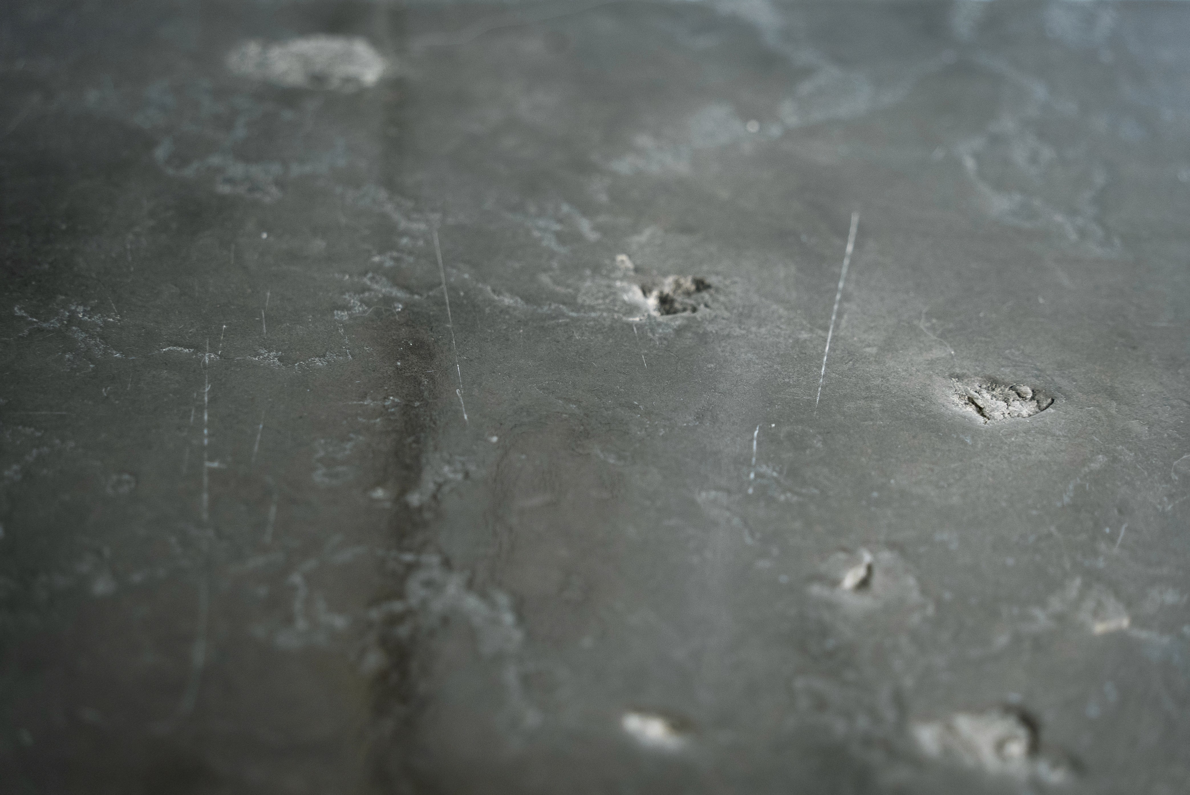 Limestone floor with natural surface pits.