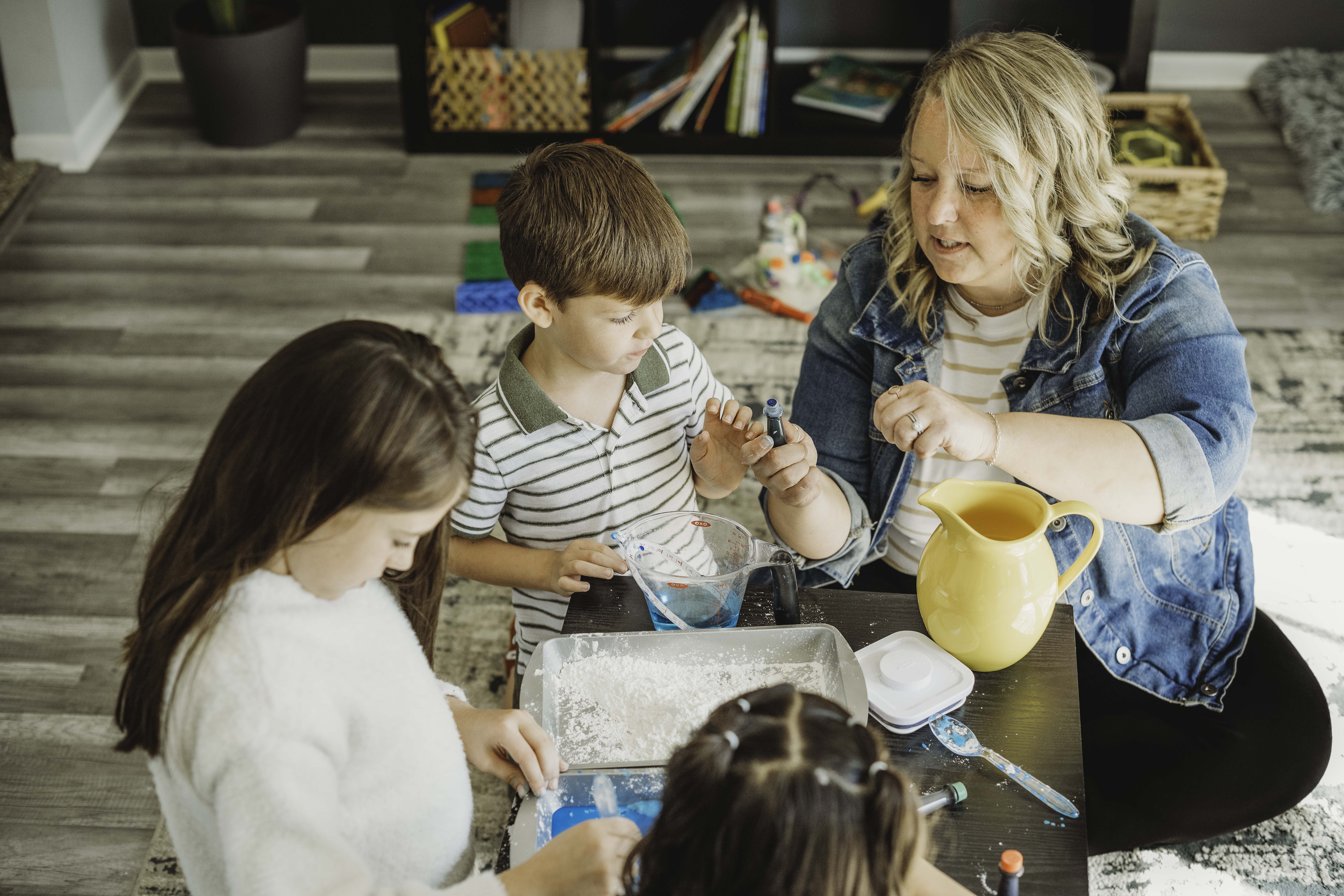 A schoolgirl participates in an online lesson using a tablet