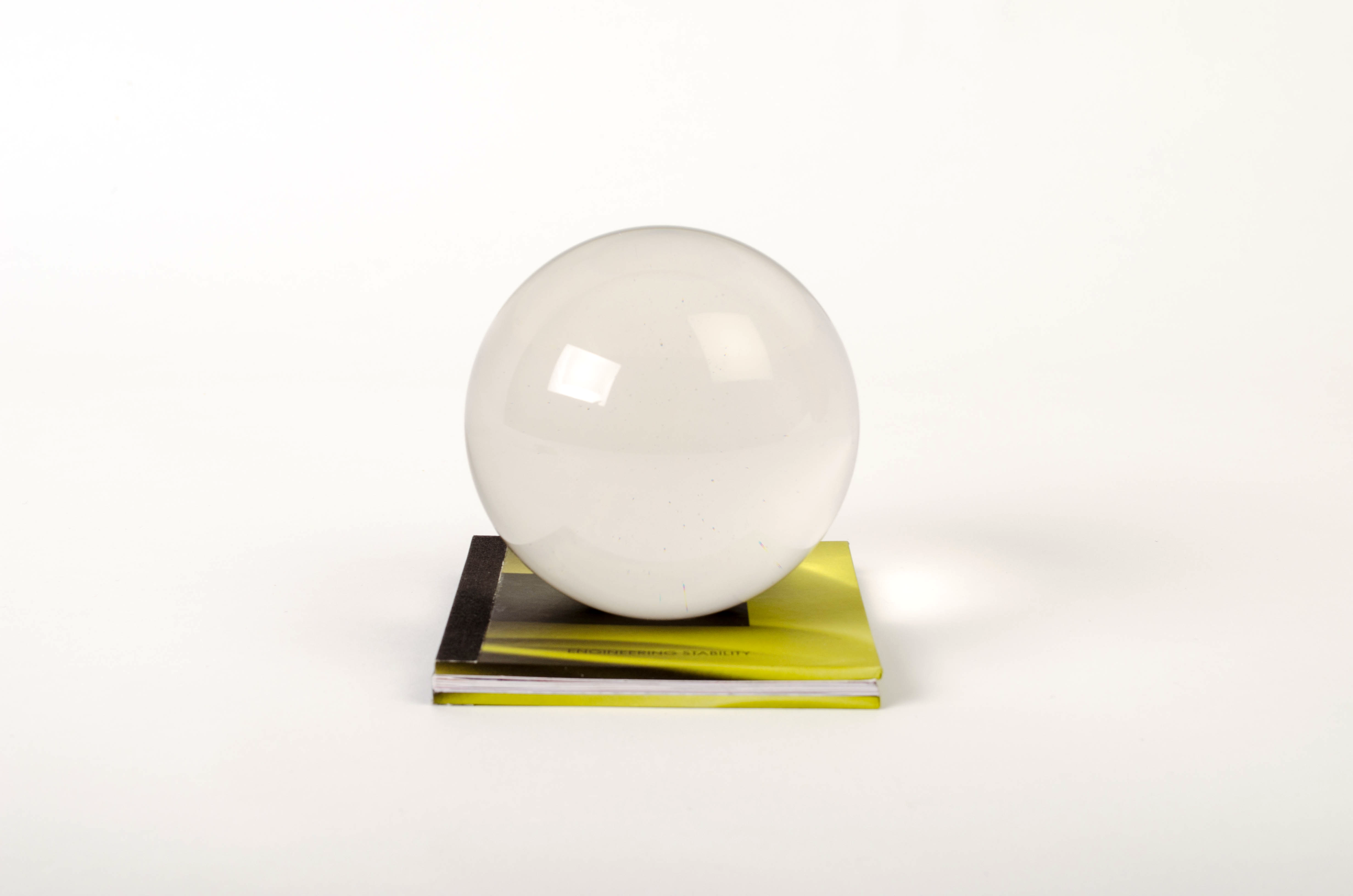 Image of glass globe sitting on a book