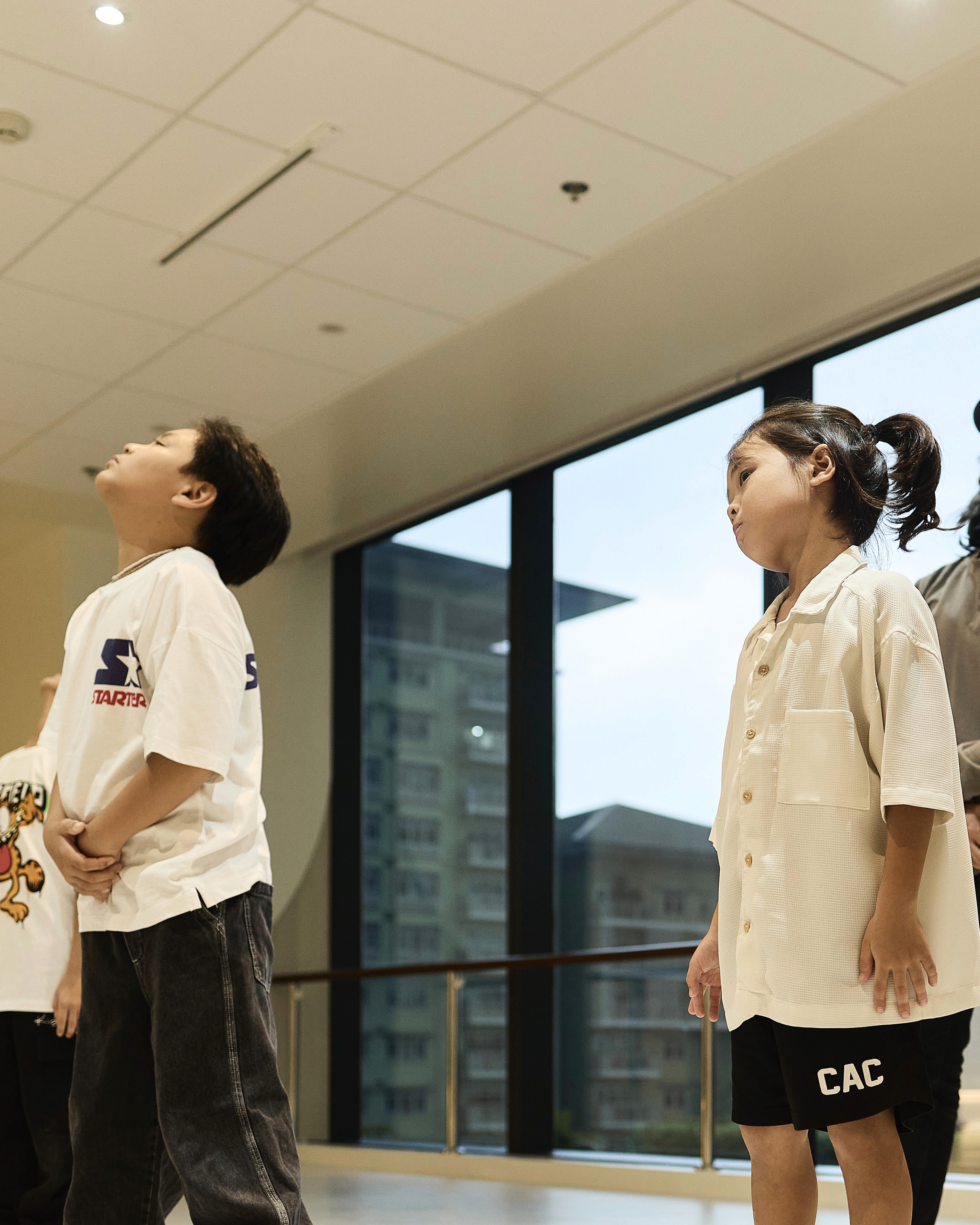 teacher teaching kid breakdancing in BGC Taguig
