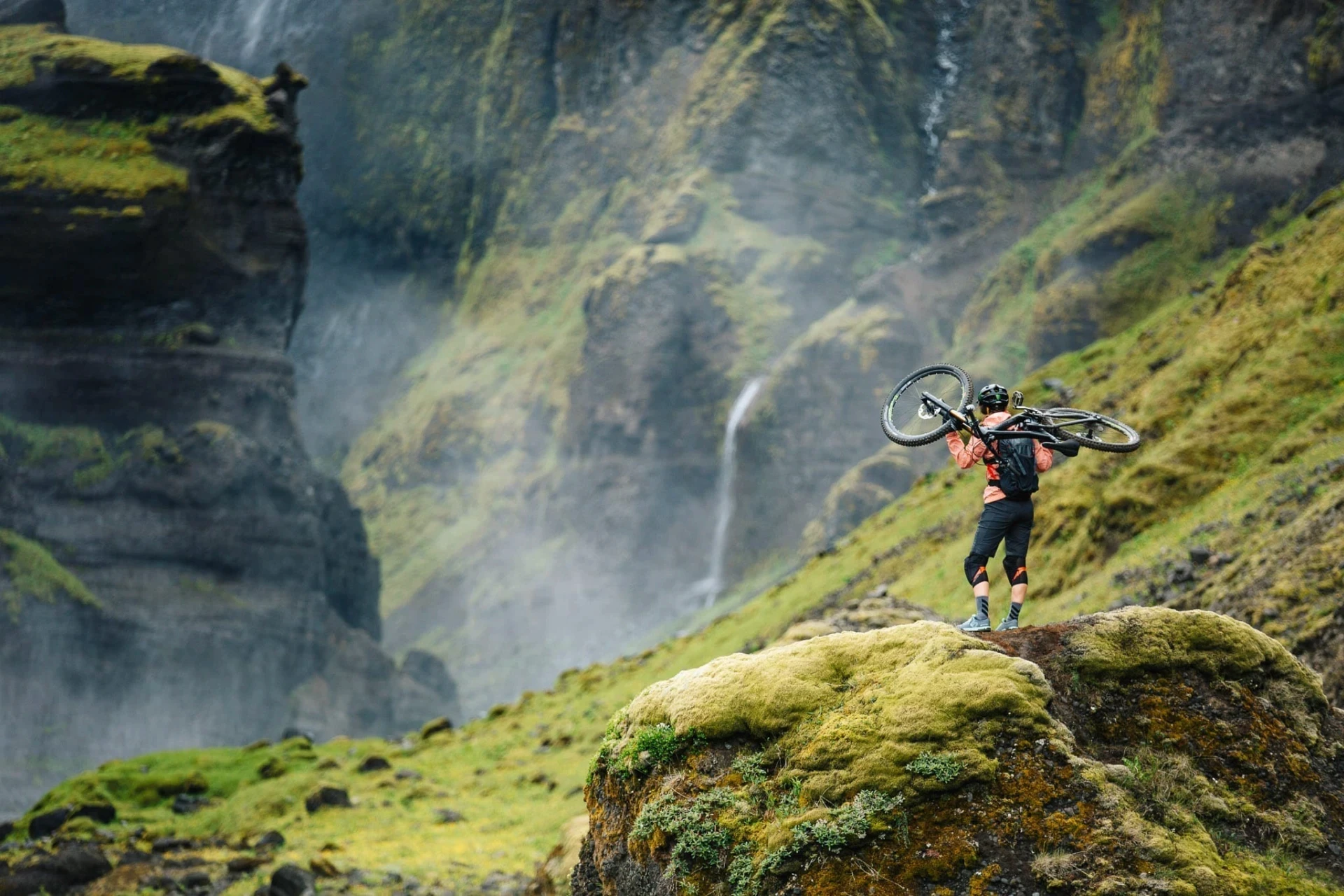 Carrying bike over hill
