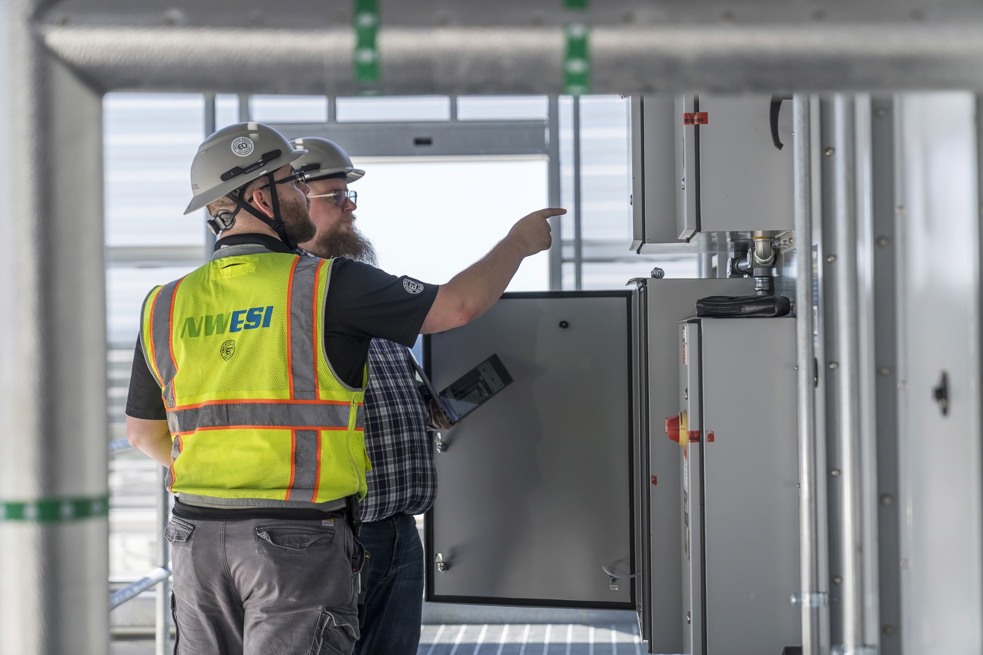 NWESI field technician performing building system commissioning work