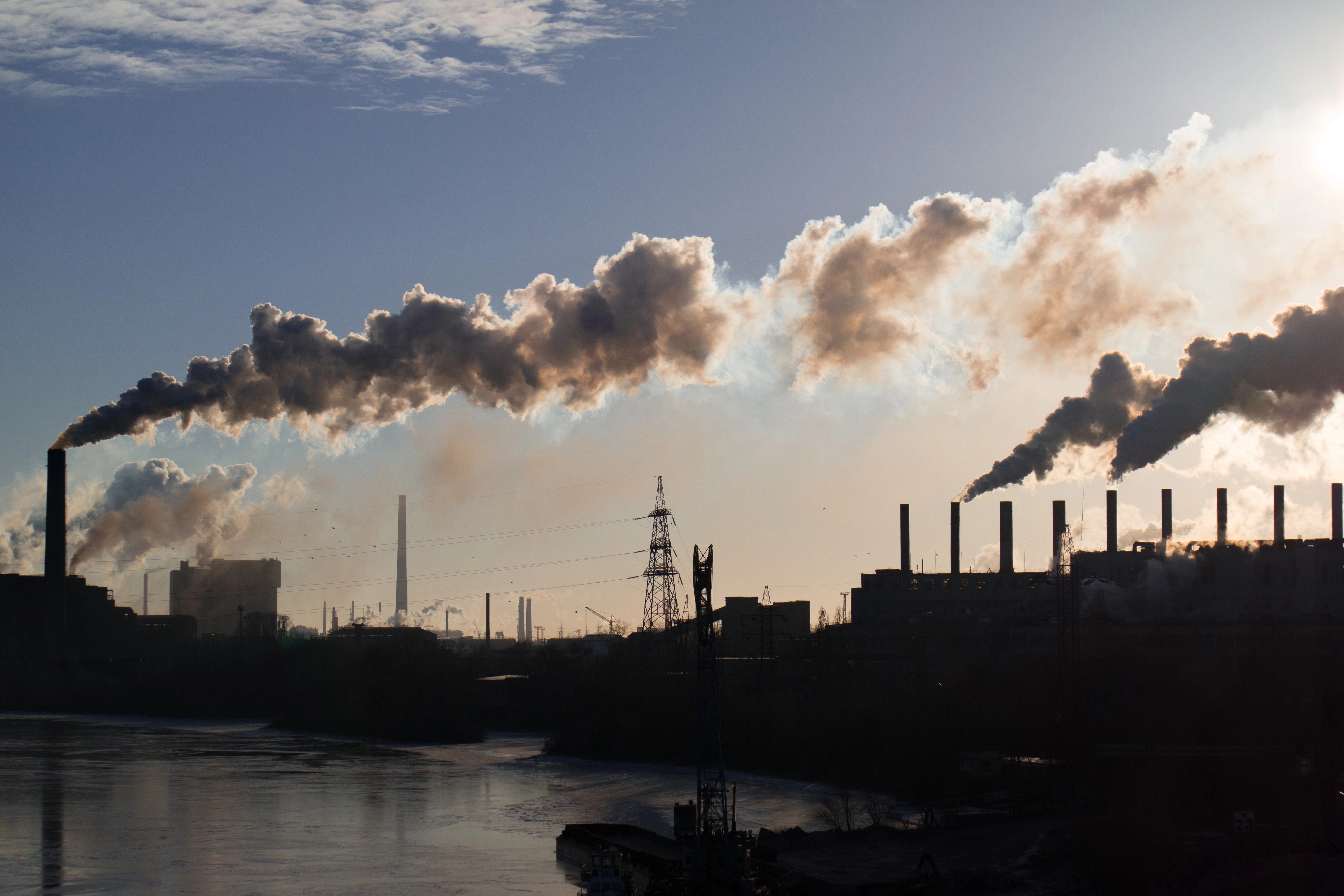 Big industrial plant on lake shoreline