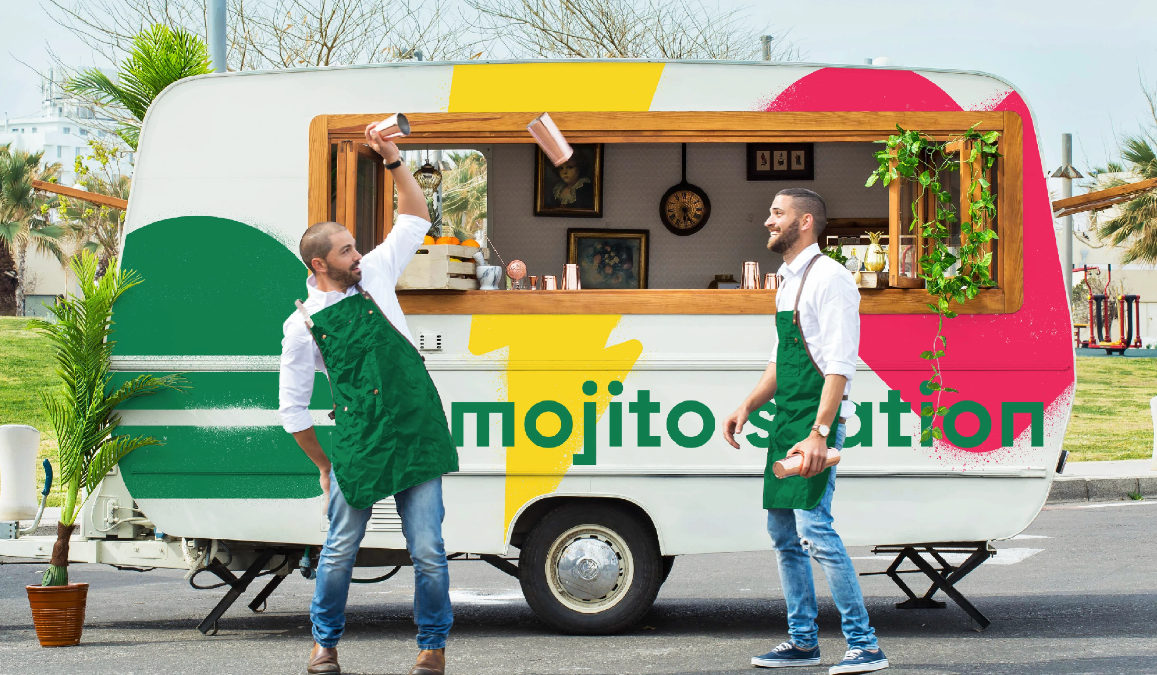 ZAD BRANDMARK, SHARJAH, UNITED ARABI EMIRATES, UAE, TWO BARISTAS, MAKING FRESH COFFE INFRONT OF A COLOURFUL FOOD TRUCK