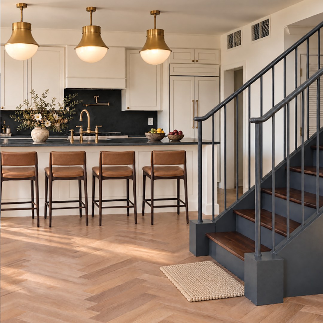 Kitchen with brass pendants beside the stair