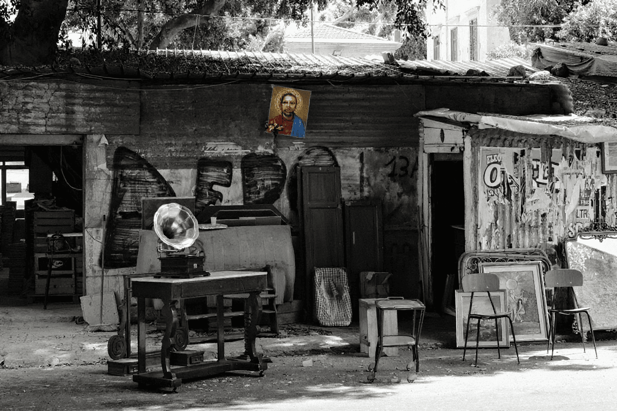 Black and white image of an antique-filled shop or room.