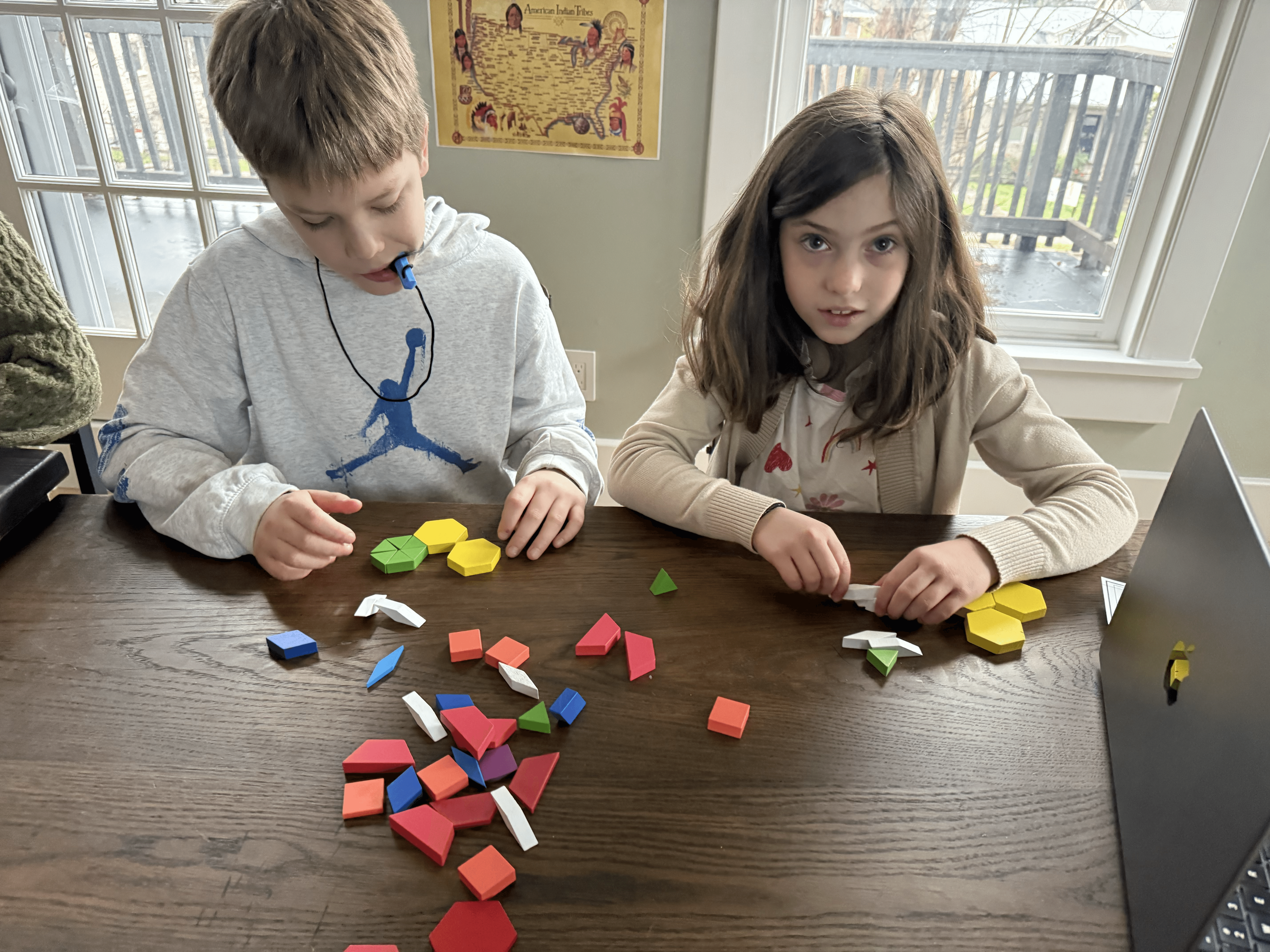 a little girl wearing a white lab coat and goggles