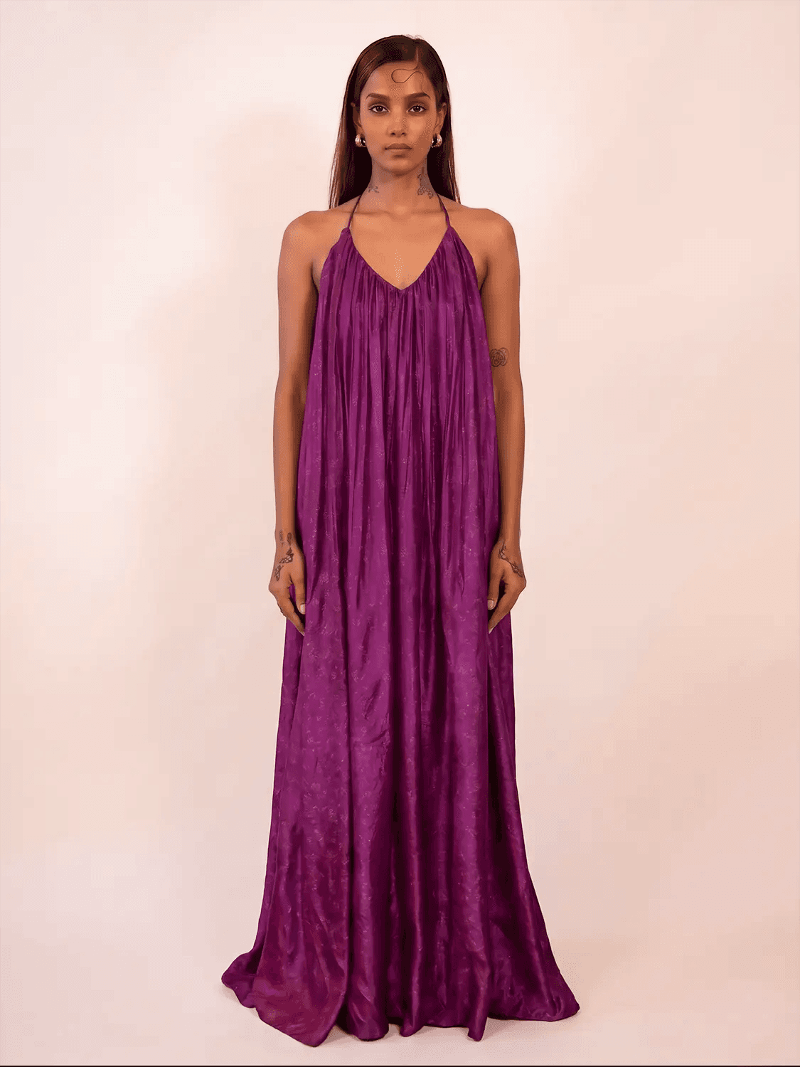 SAHIBA is our one-of-a-kind deep V backless dori dress, handcrafted by skilled artisans in-house using a one-of-a-kind vintage silk saree. 