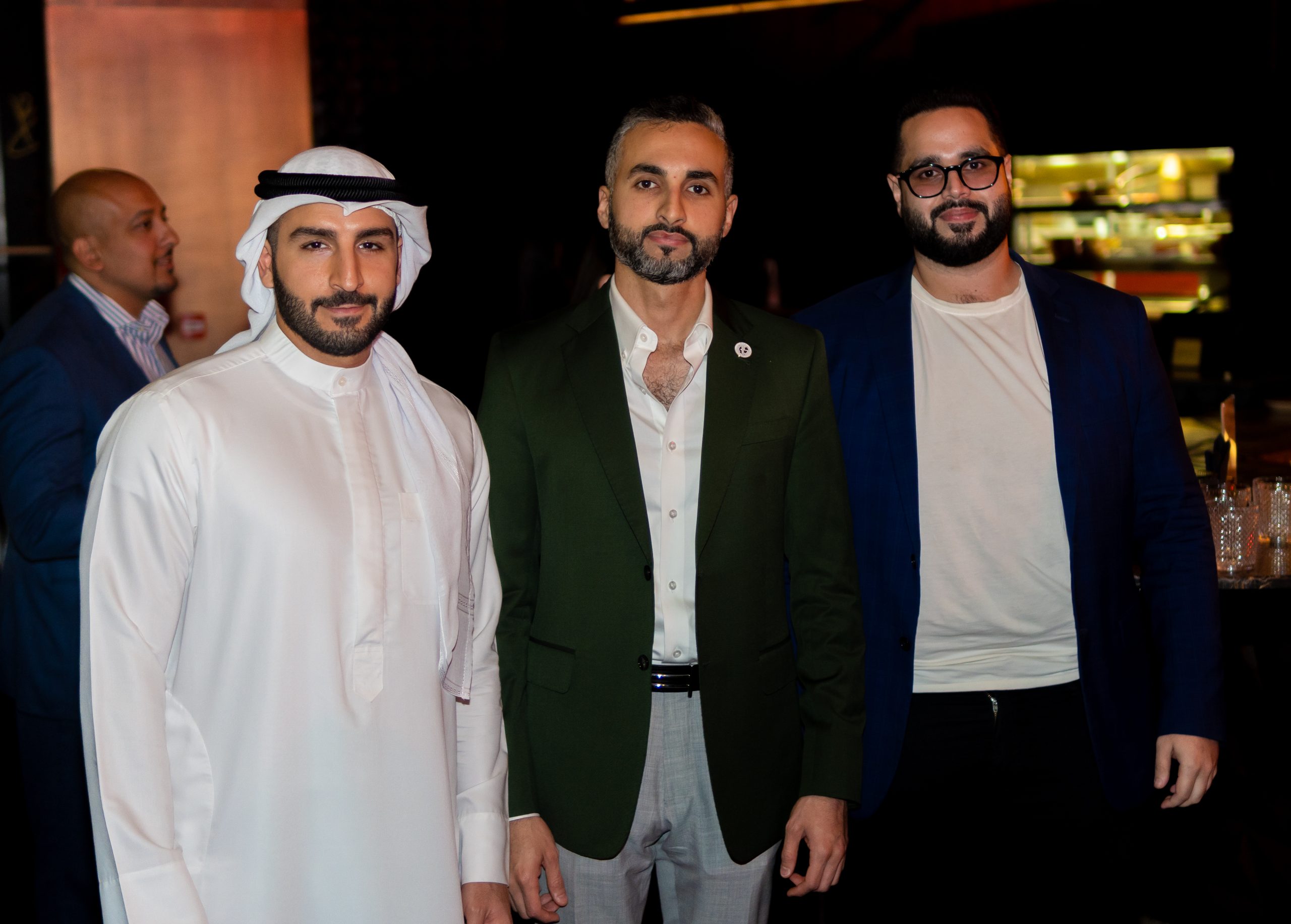 A minimalist wooden desk with a small lamp and an open notebook, situated in a bright, warm-lit room.