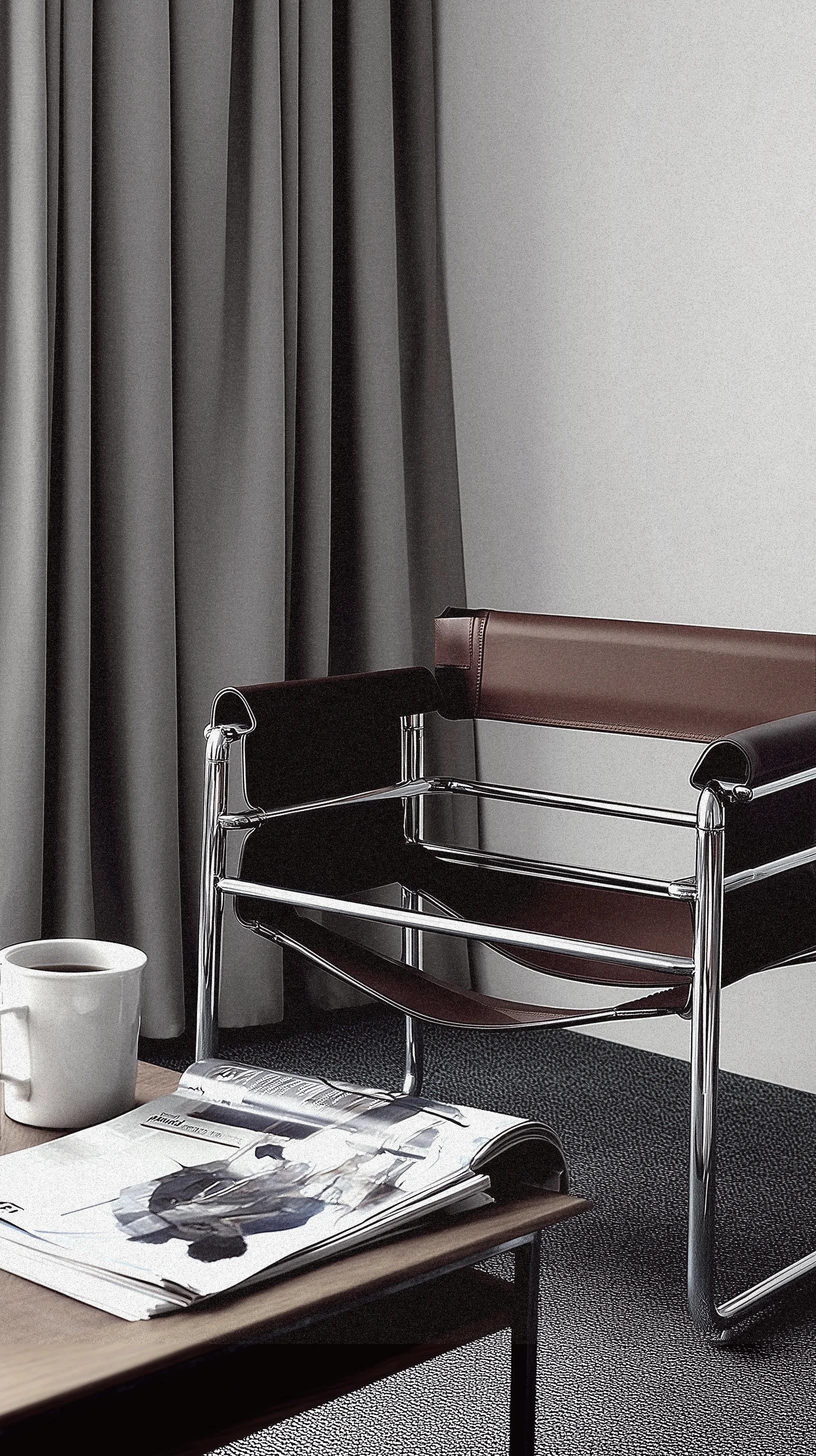 Minimalist interior with a black leather lounge chair, side table with a coffee cup and magazines, against a grey wall and curtain