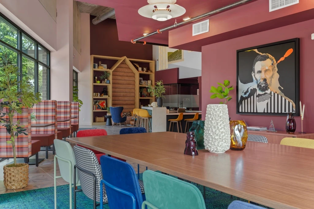 A vibrant conference room, showcasing an array of colorful chairs for attendees.