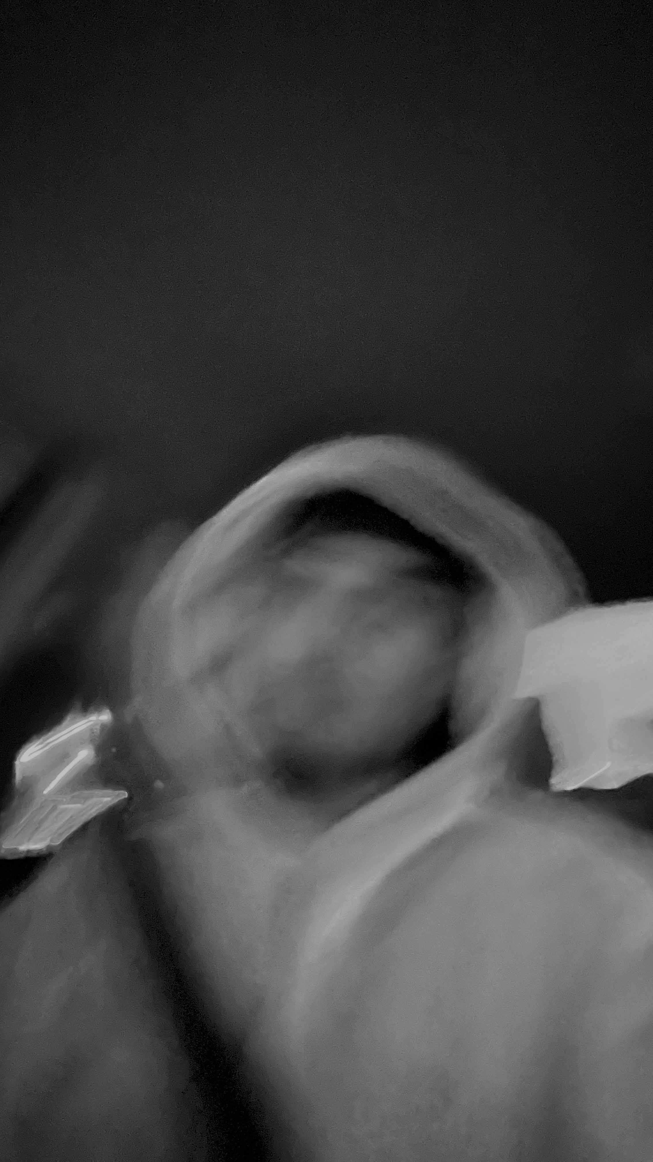 a blurry photo of a person standing in front of a wall