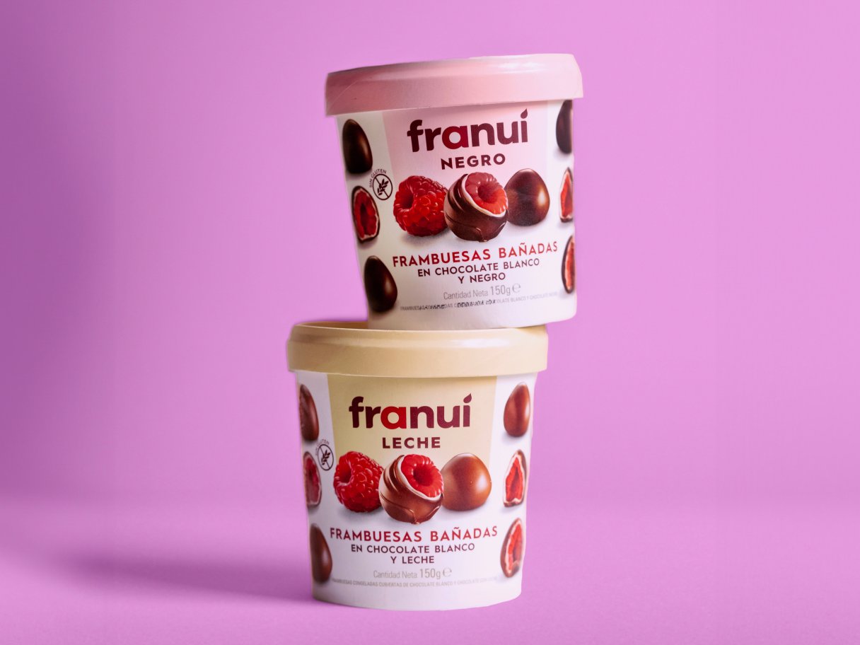 Rooftops of a coastal town with the sea in background