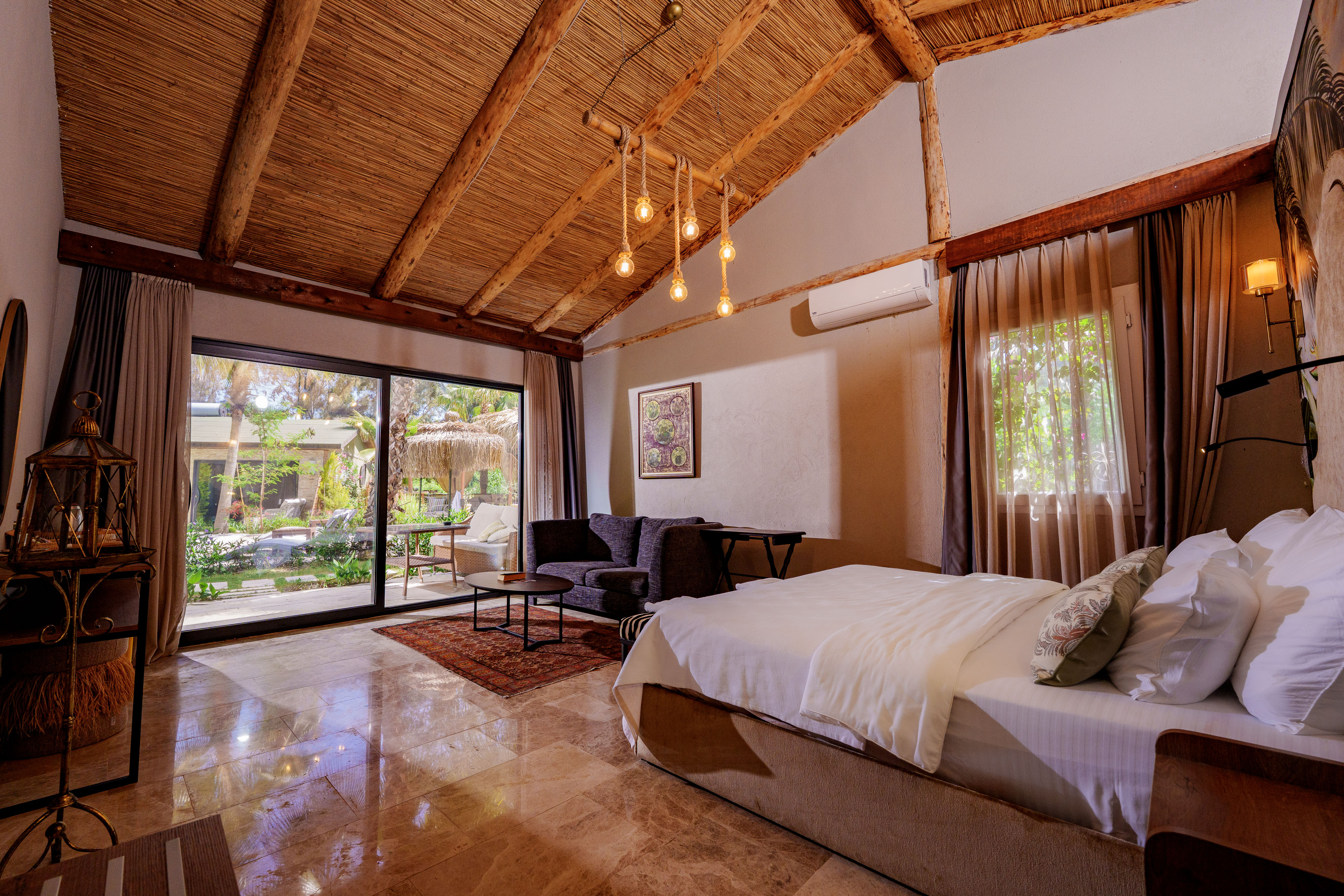 the elevated sleeping area with warm bedding, soft lighting, minimalist stairs, and smooth wood finishes.