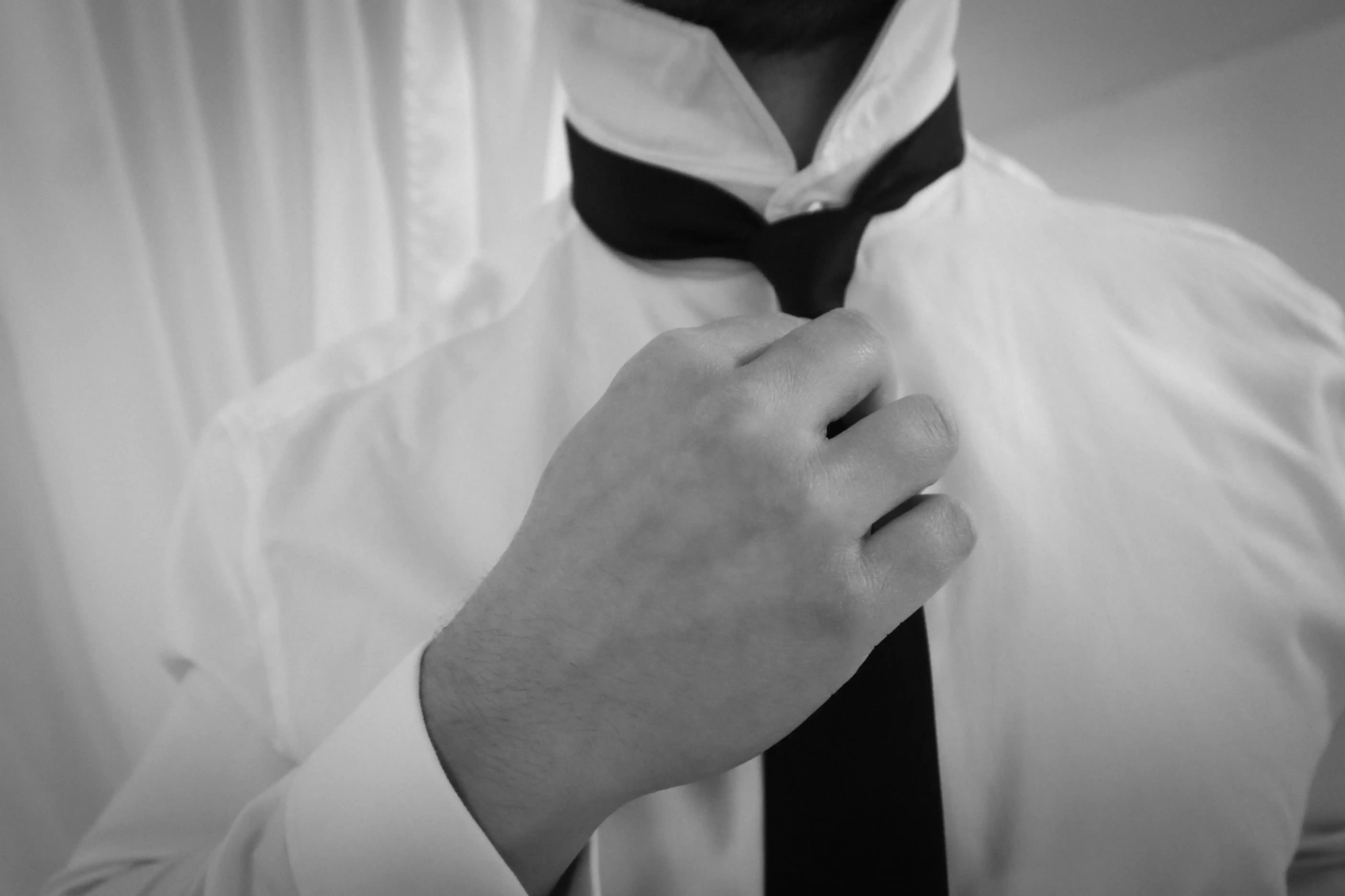 Groom getting ready inside Ashlar Ottawa heritage venue