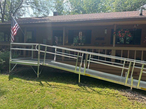Side view handicap accessibilty ramp off porch