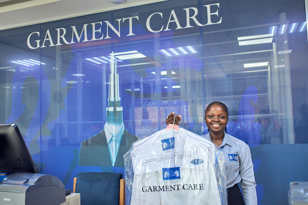 person holding knitted textiles