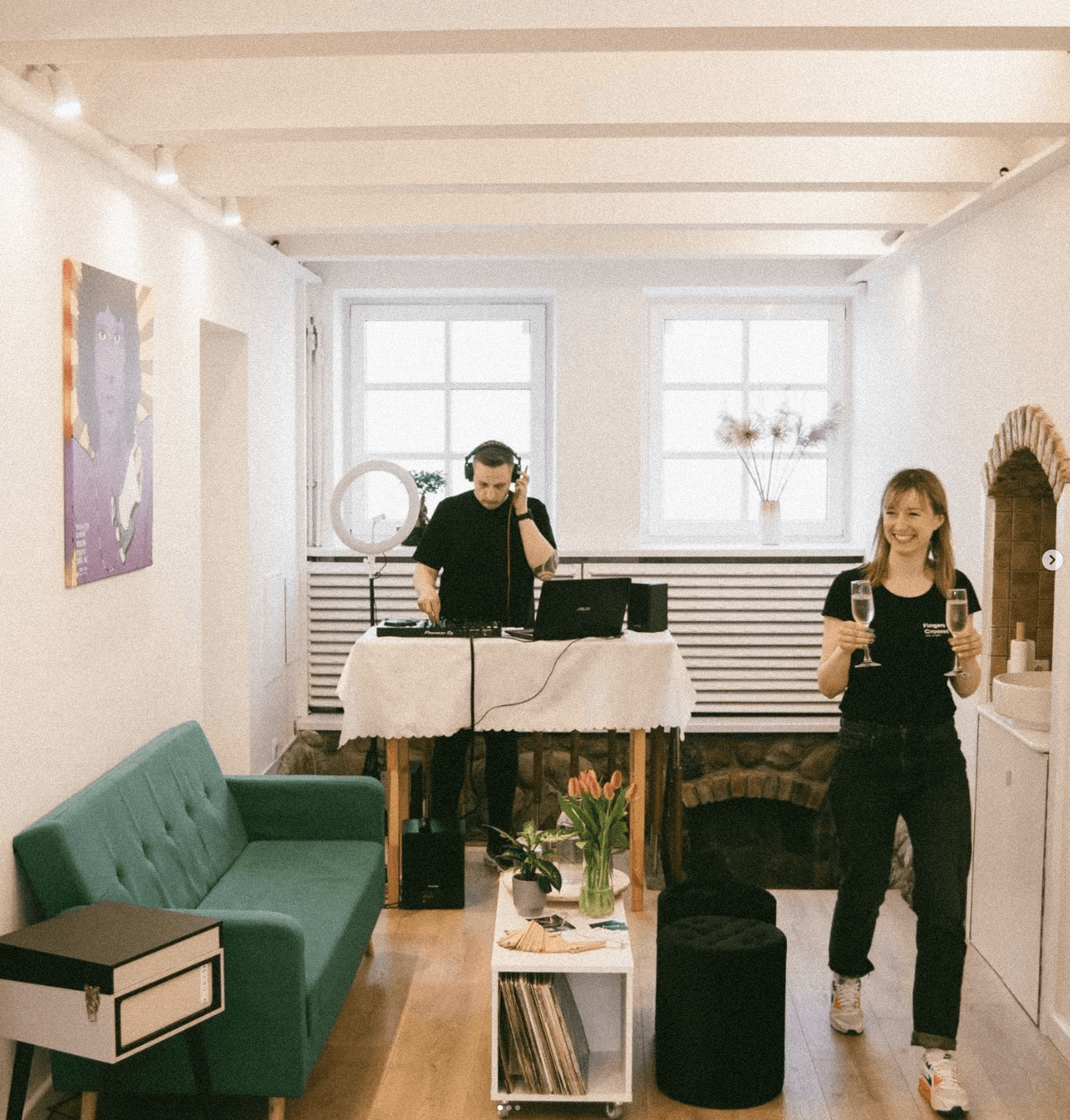 Woman applying cuticle oil with a dropper on manicured nails