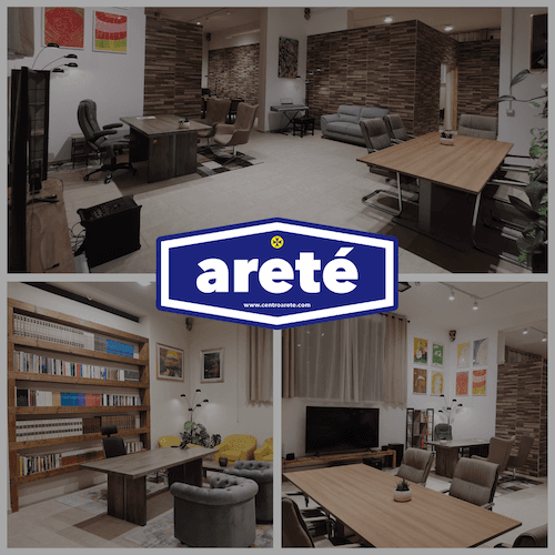 Modern office interior with glass walls, wooden accents, and a person walking up a staircase in motion blur.