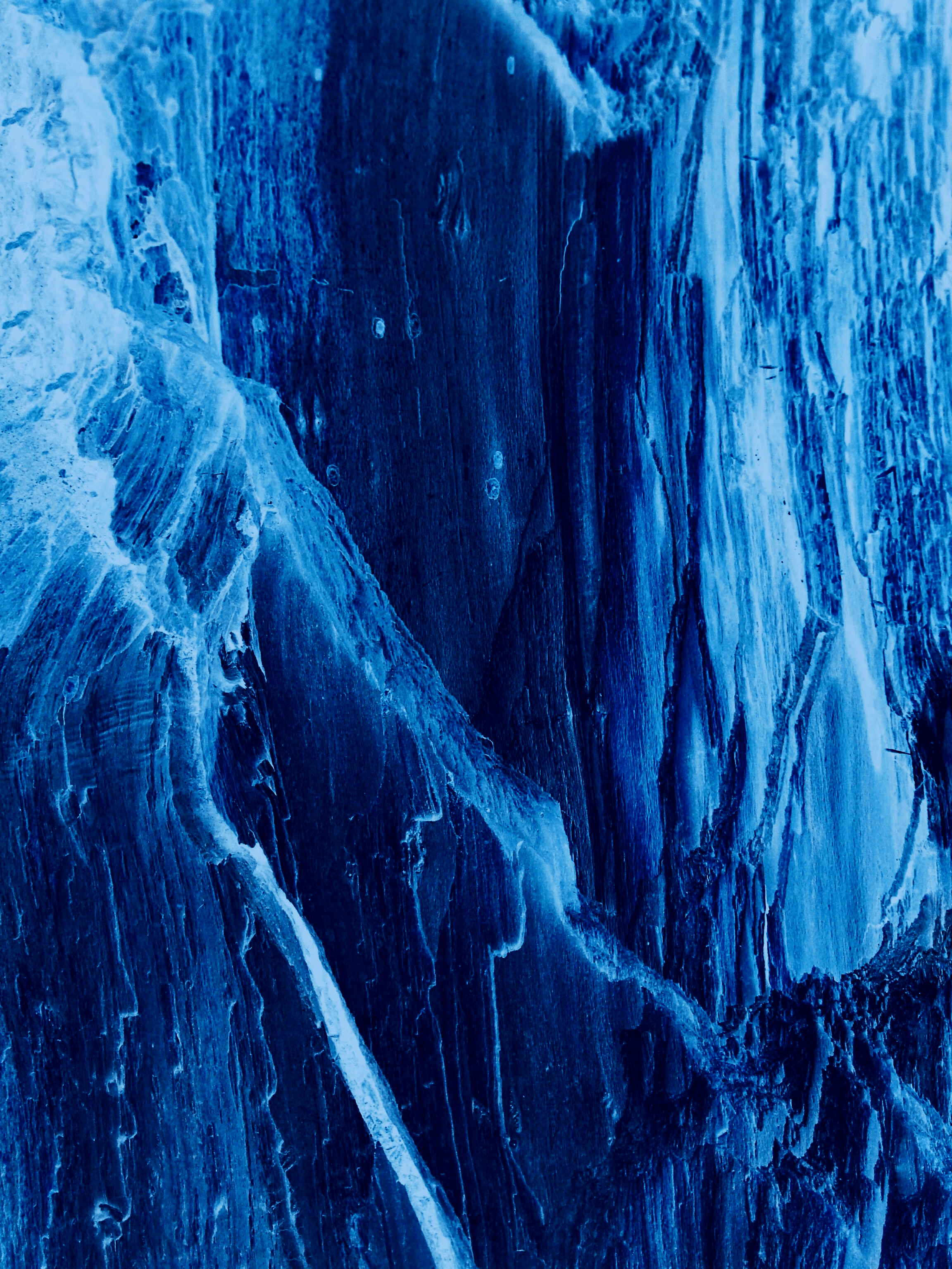 a man standing on top of a snow covered mountain
