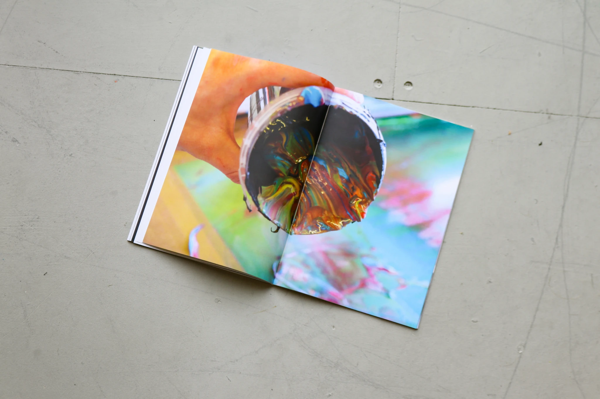 On Creativ-ity spread with a colourful photo of a hand holding a disc