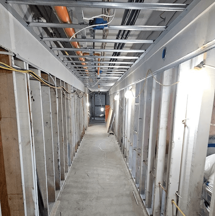Close-up of metal studs forming walls on a construction site