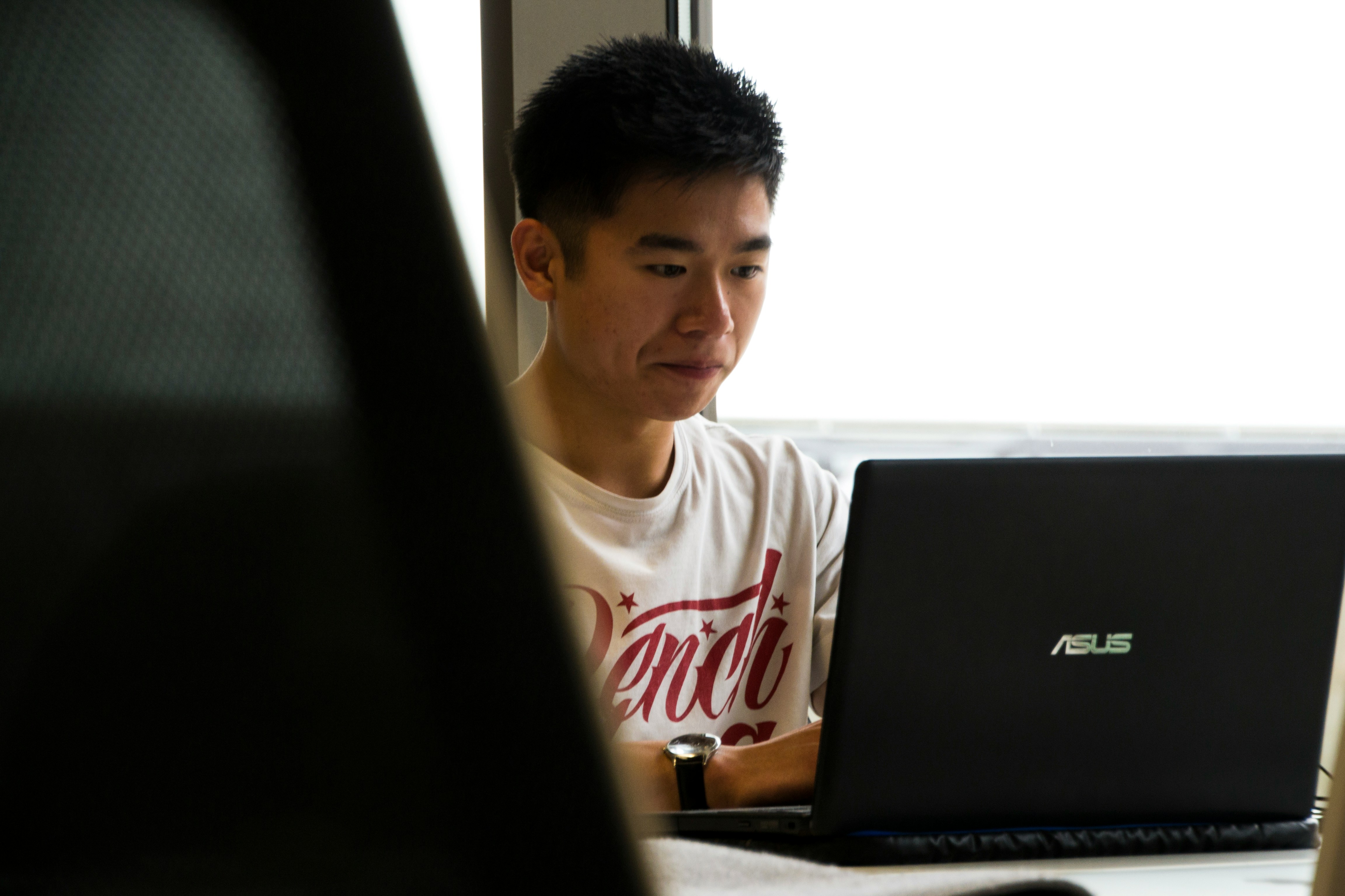 college student on his laptop - End Of Rotation Exams