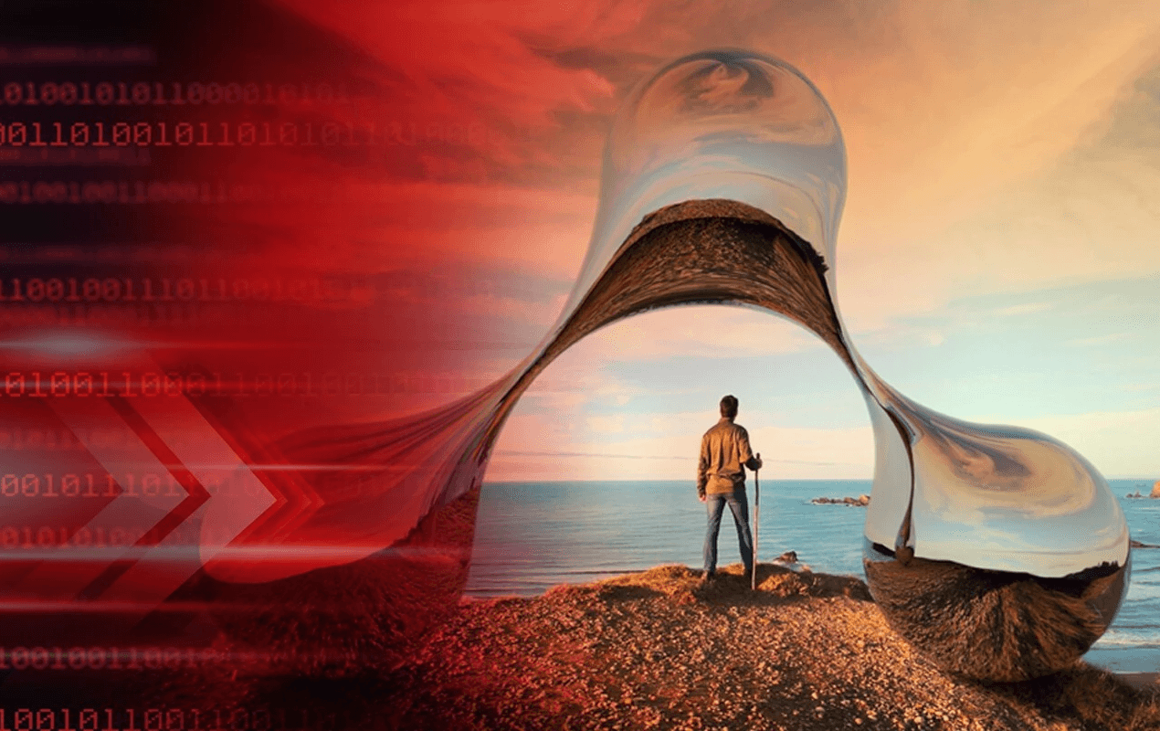 A man standing looking at the ocean as he stands beneath the Ardia logo.