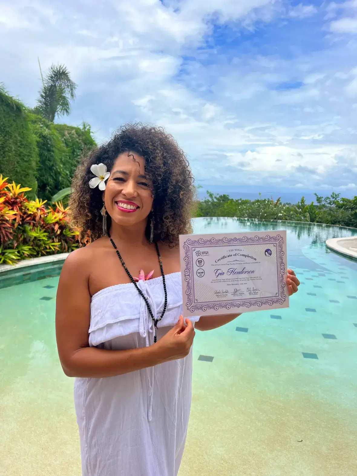 Graduate with certificate by the infinity pool
