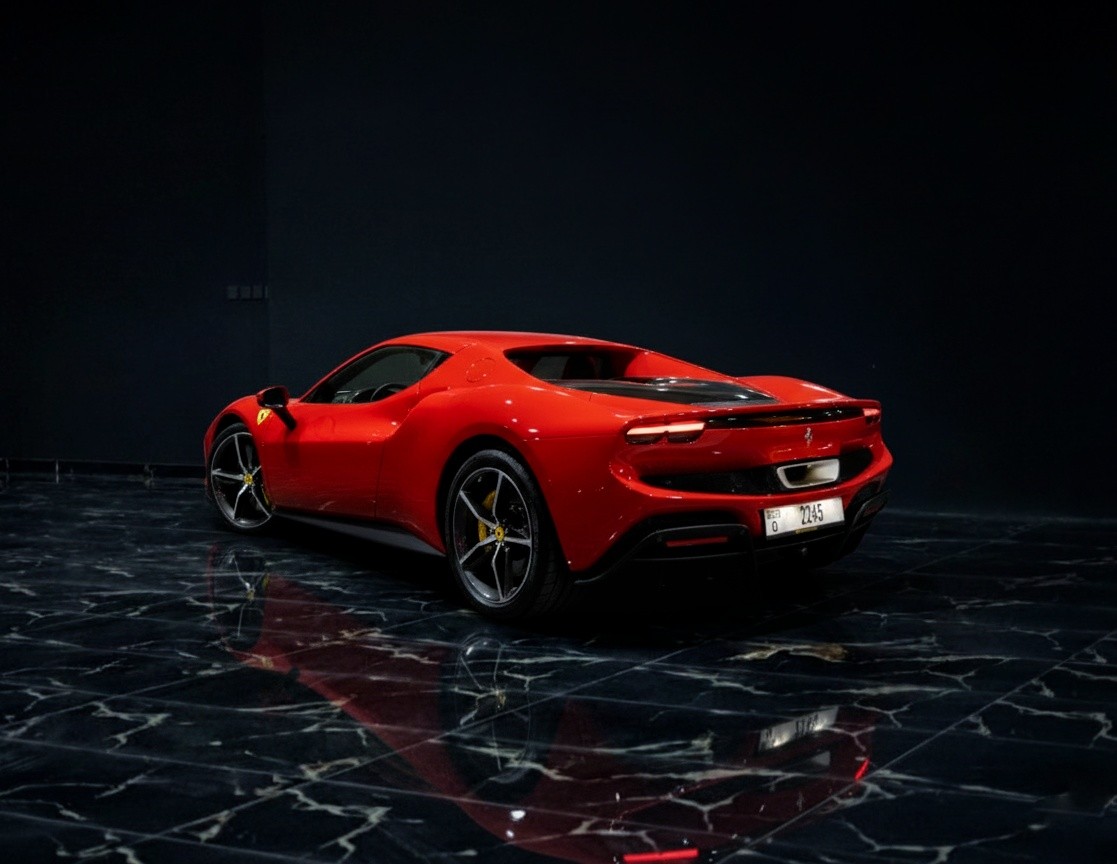 Ferrari 296 GTB rear view red hybrid supercar available for rent in Dubai
