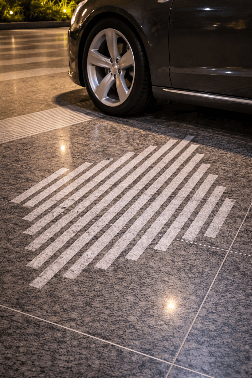 Modern striped stone flooring applied in residential driveway and exterior surface design